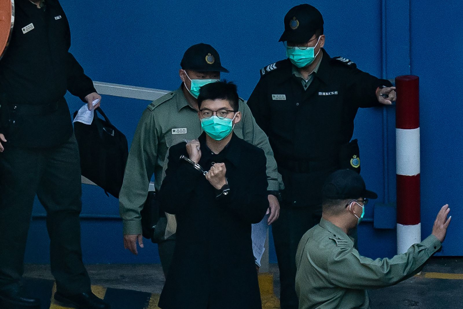 Hong Kong activist Joshua Wong prepares to board a prison van in 2020 in Hong Kong.