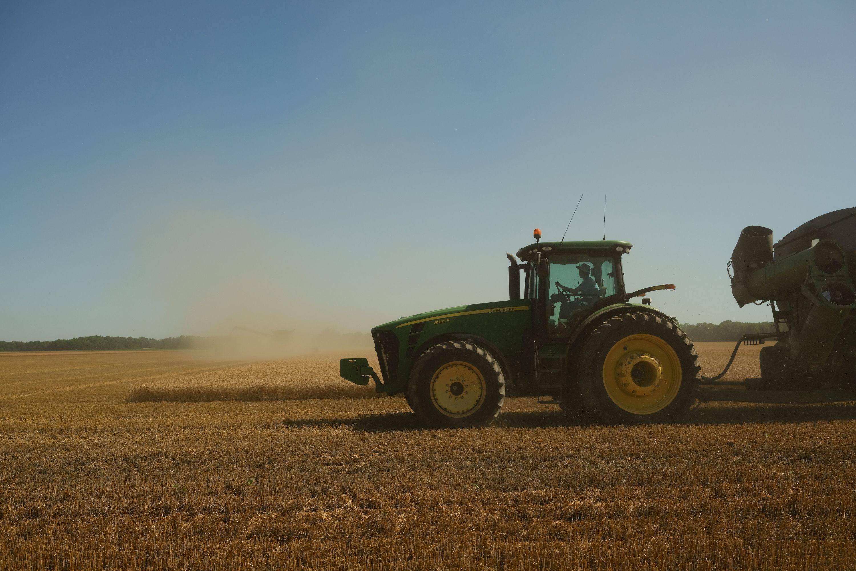 A farmer harvests wheat in Culver, Kansas.