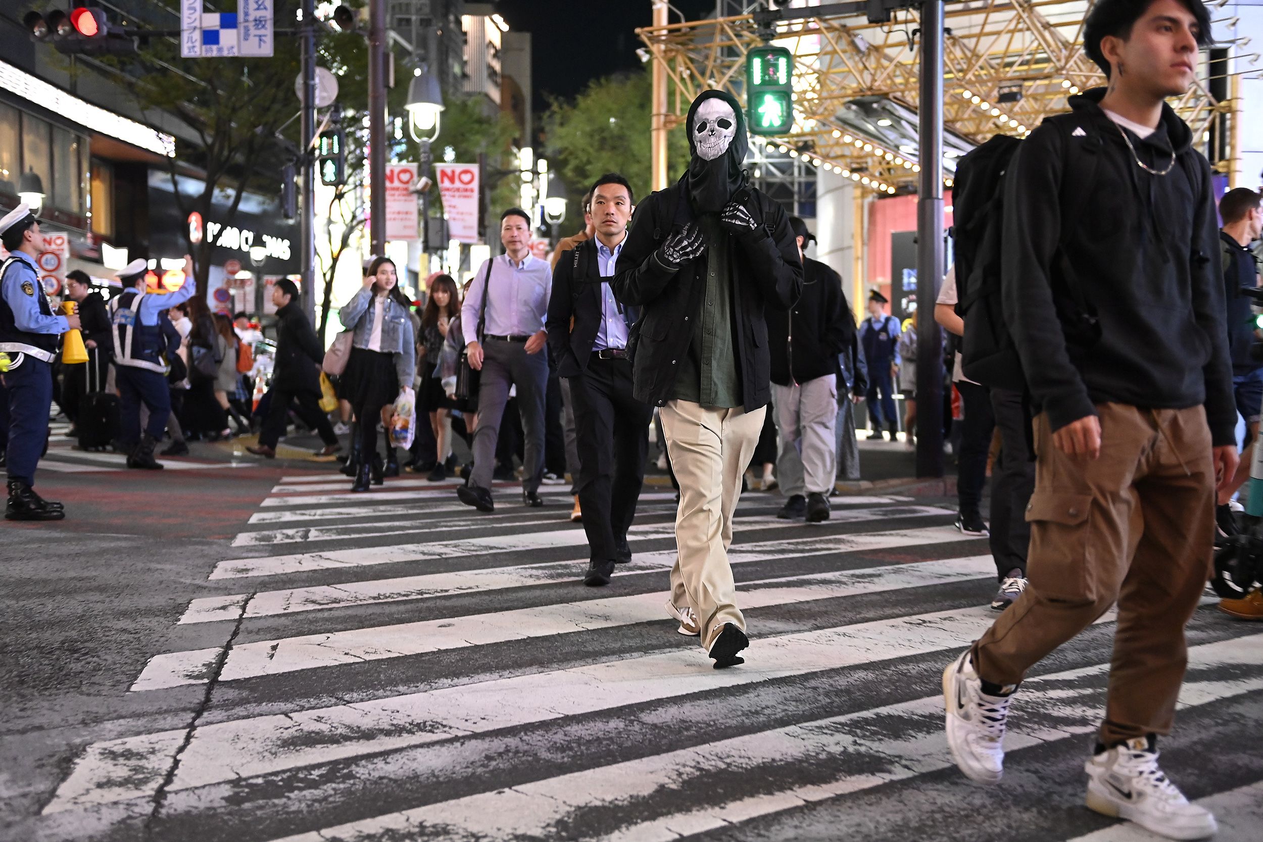 Tokyoites, some in costume and some not, mingle in Shibuya on Halloween 2024.