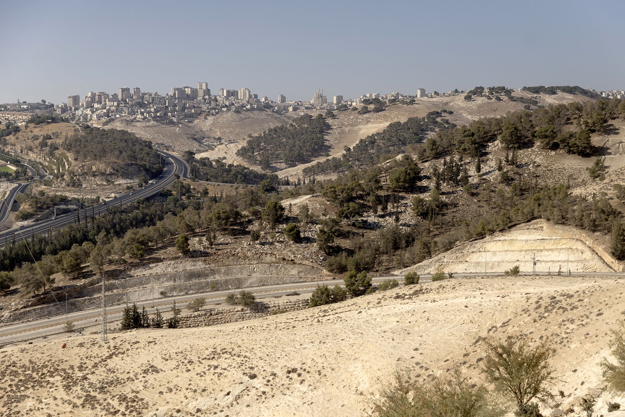 UNSPECIFIED, ISRAEL - AUGUST 22: A view over the area where the Israeli government plans to build a new neighborhood as part of E1 settlement project, near the Jewish settlement of Ma'ale Adomim on August 22, 2025 in near Jerusalem, Israel. On Wednesday Israel approved plans put forward by far-right Finance Minister Bezalel Smotrich that would see a new Israeli settlement of 3,400 homes built east of Jerusalem in the E1 zone, effectively bisecting much of the occupied West Bank. Until now construction in the area has been prohibited for two decades, and is considered illegal under international law. The move has been condemned by the international community, with critics accusing Israel of sabotaging any prospect of a future two-state solution. (Photo by Amir Levy/Getty Images)
