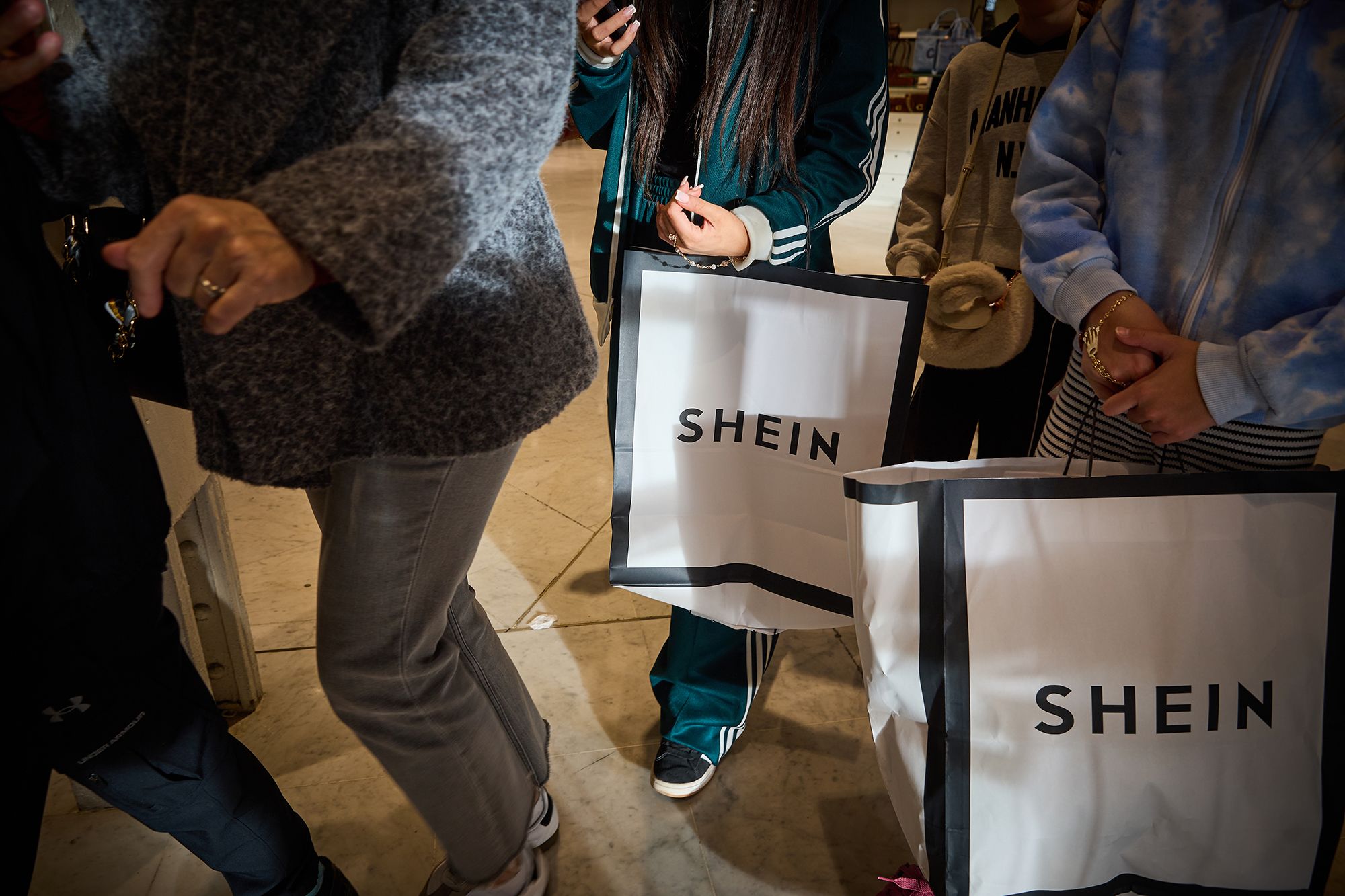 Shoppers visit Shein's first physical store in the BHV Marais Department Store on its opening day last winter in Paris, France. The partnership between the brand and the Paris Department store has provoked criticisms by politicians, unions and top fashion brands.
