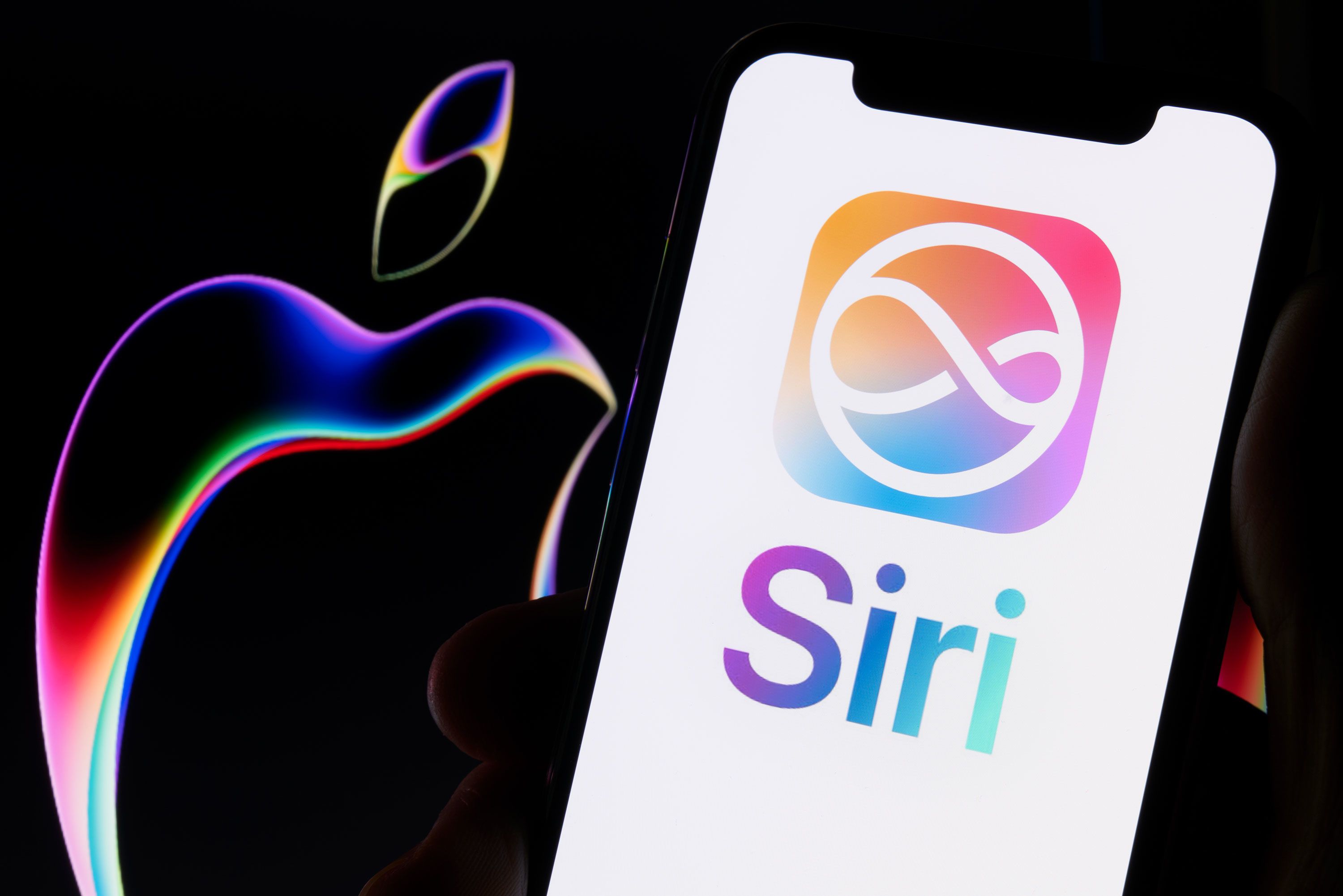 An iPhone displays the Apple Intelligence and Siri branding.