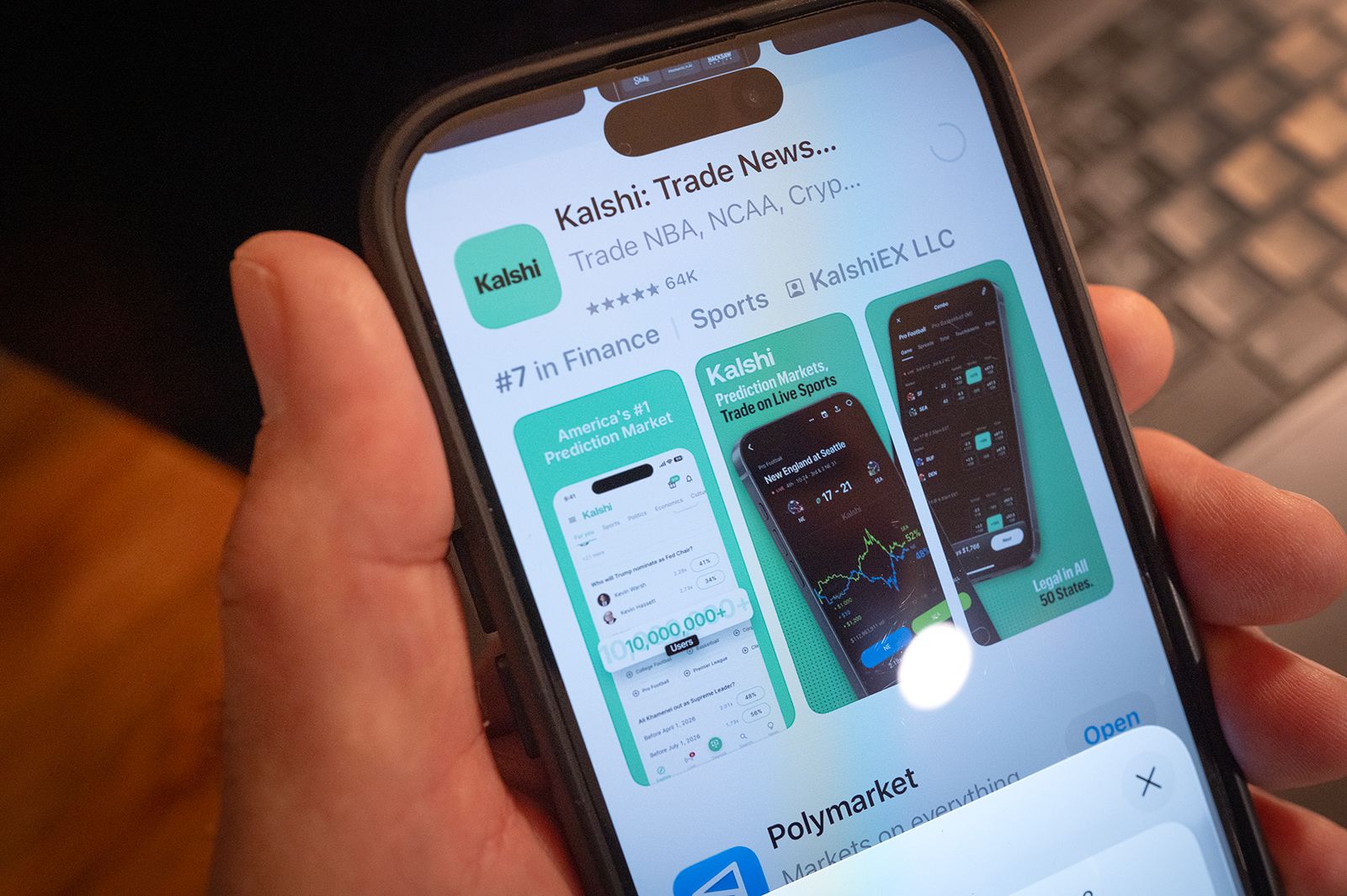 An app for Kalshi is shown on a phone in Chicago, on February 25. Young adults between 18 and 21 have traded billions on the prediction market so far this year.