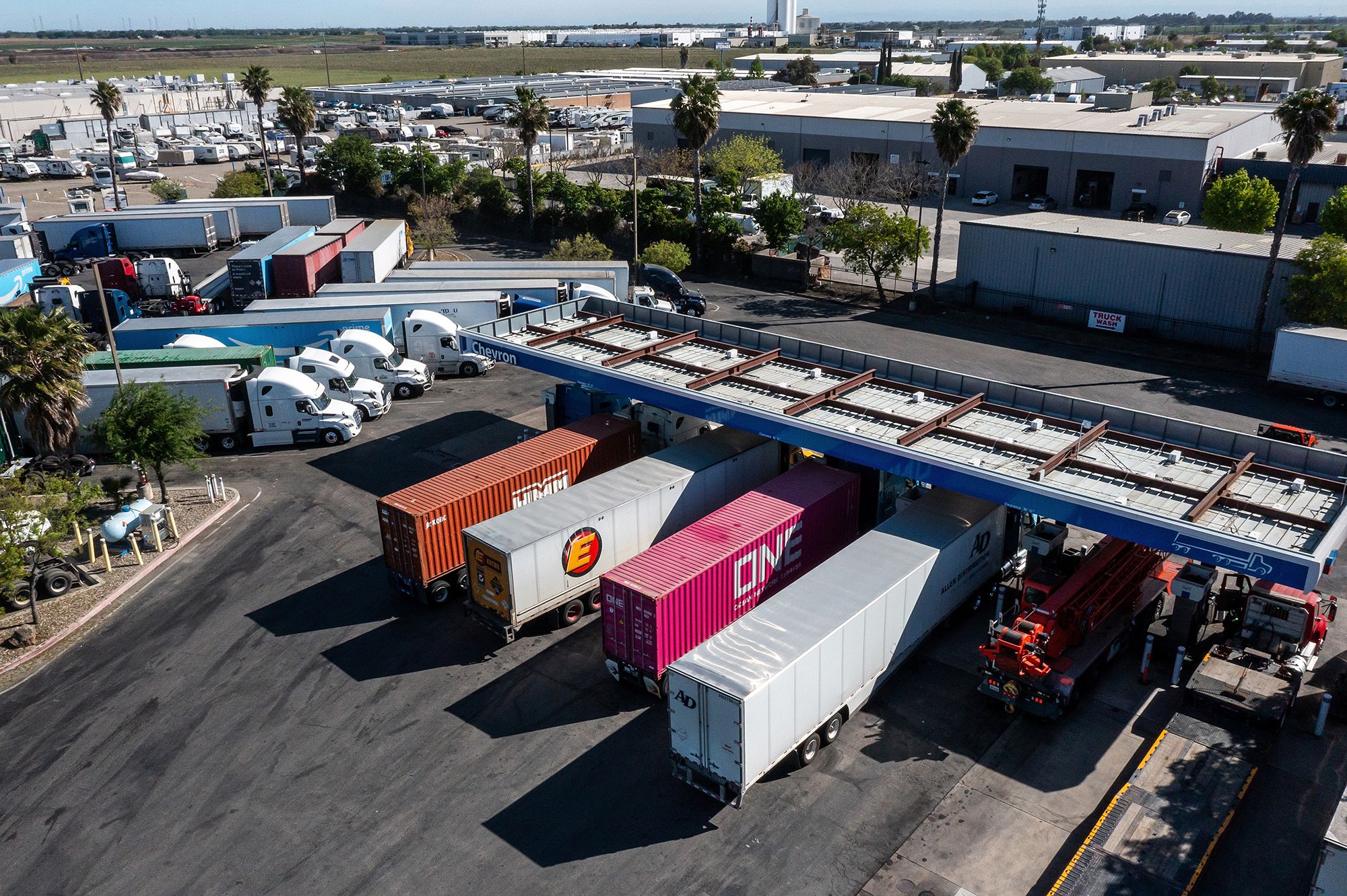 Drivers refuel tractor trailers with diesel fuel at a Chevron truck stop in Tracy, California, March 25, 2026. The average cost for a gallon of diesel in California rose to the highest level ever as the state deals with limited oil-refining capacity and as the war in Iran disrupts global energy shipments.