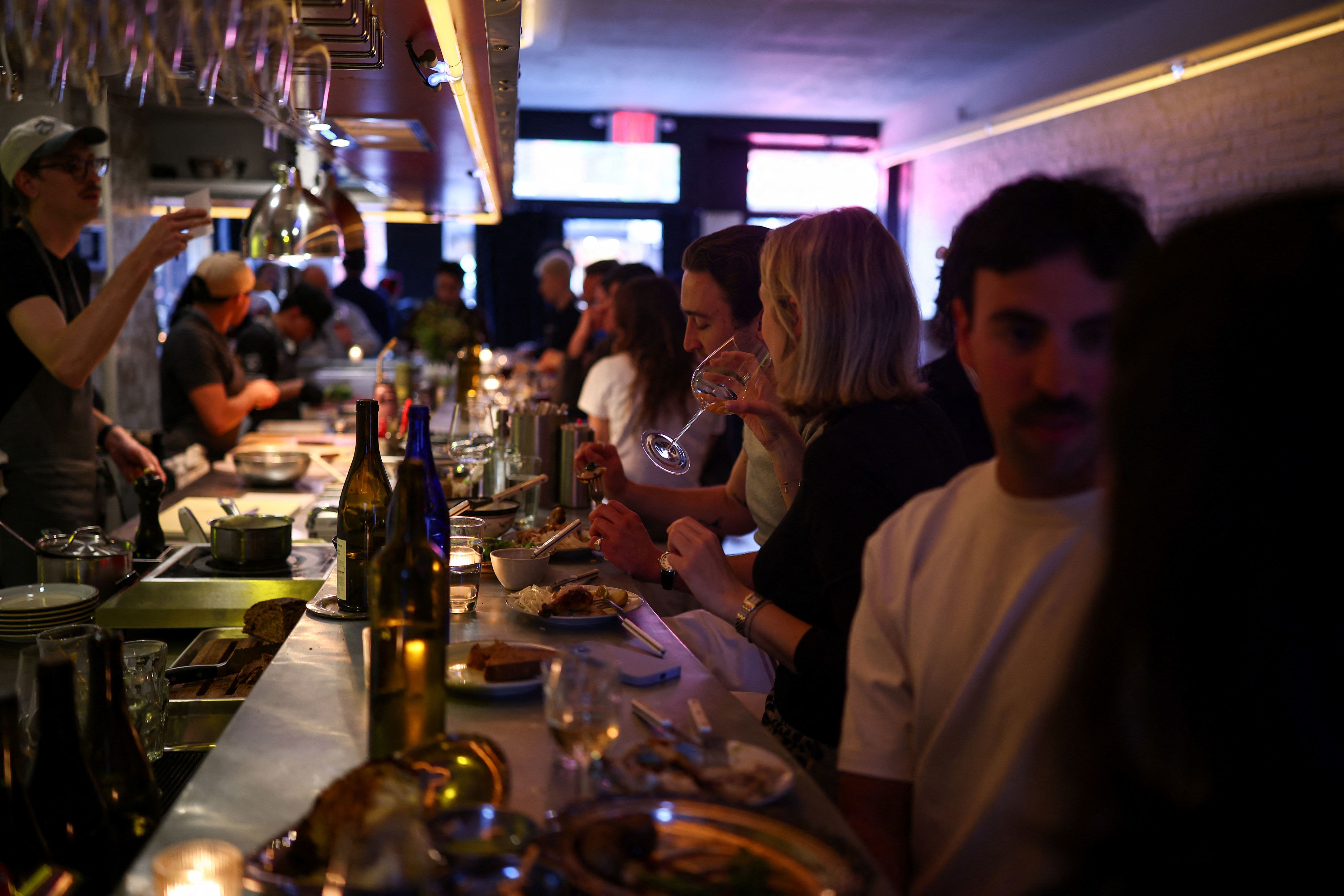 Customers eat dinner at a French restaurant in Brooklyn on April 26.