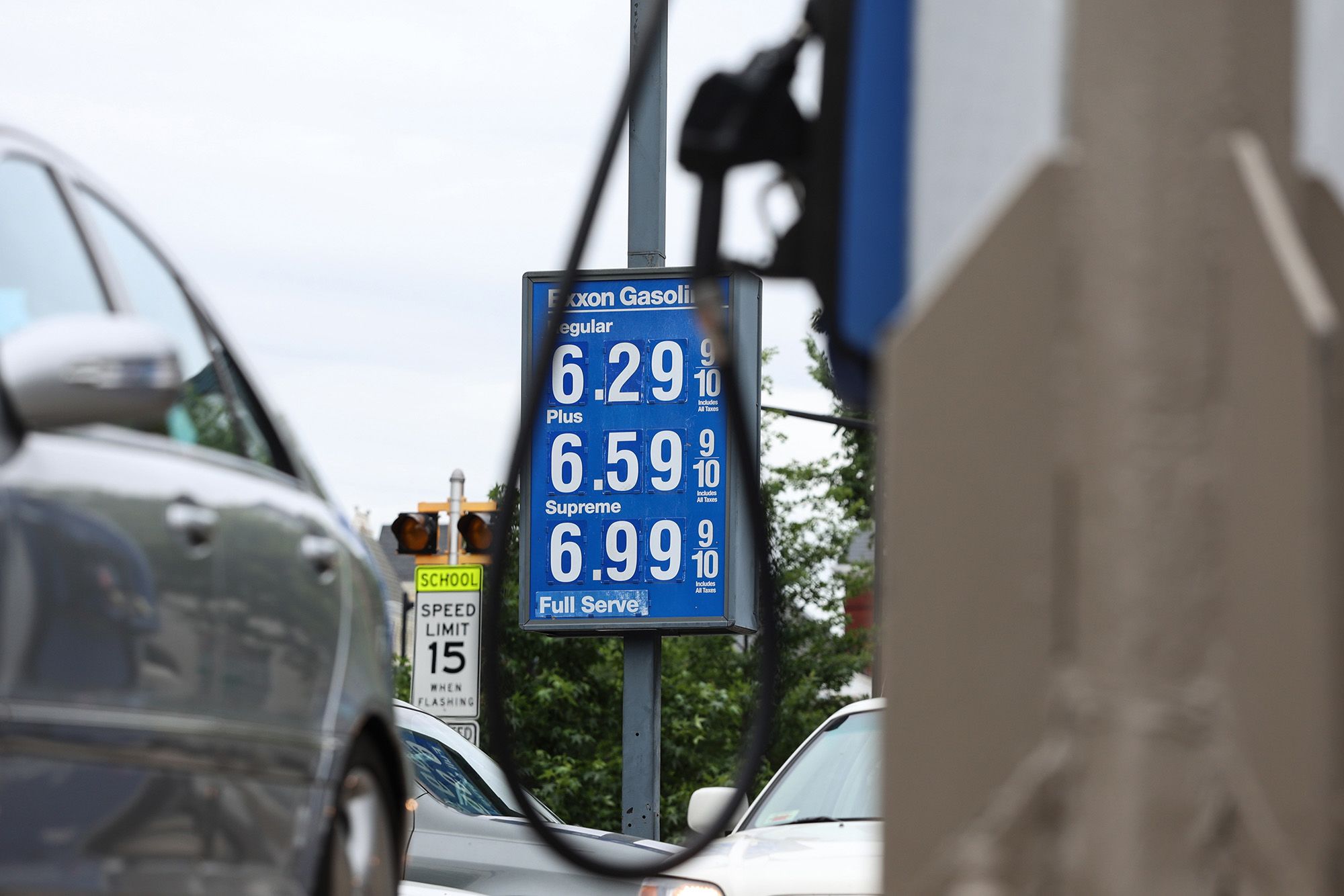 A sign displays the price of unleaded gasoline at an Exxon gas station in Washington, DC, on May 21, 2026.