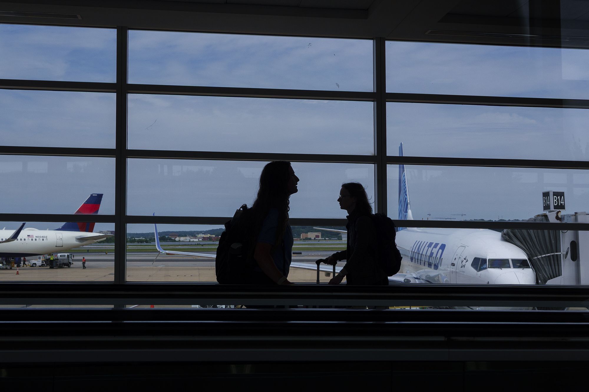 Passengers walk through the terminal at Ronald Reagan Washington National Airport on June 9, 2026, in Arlington, Virginia.