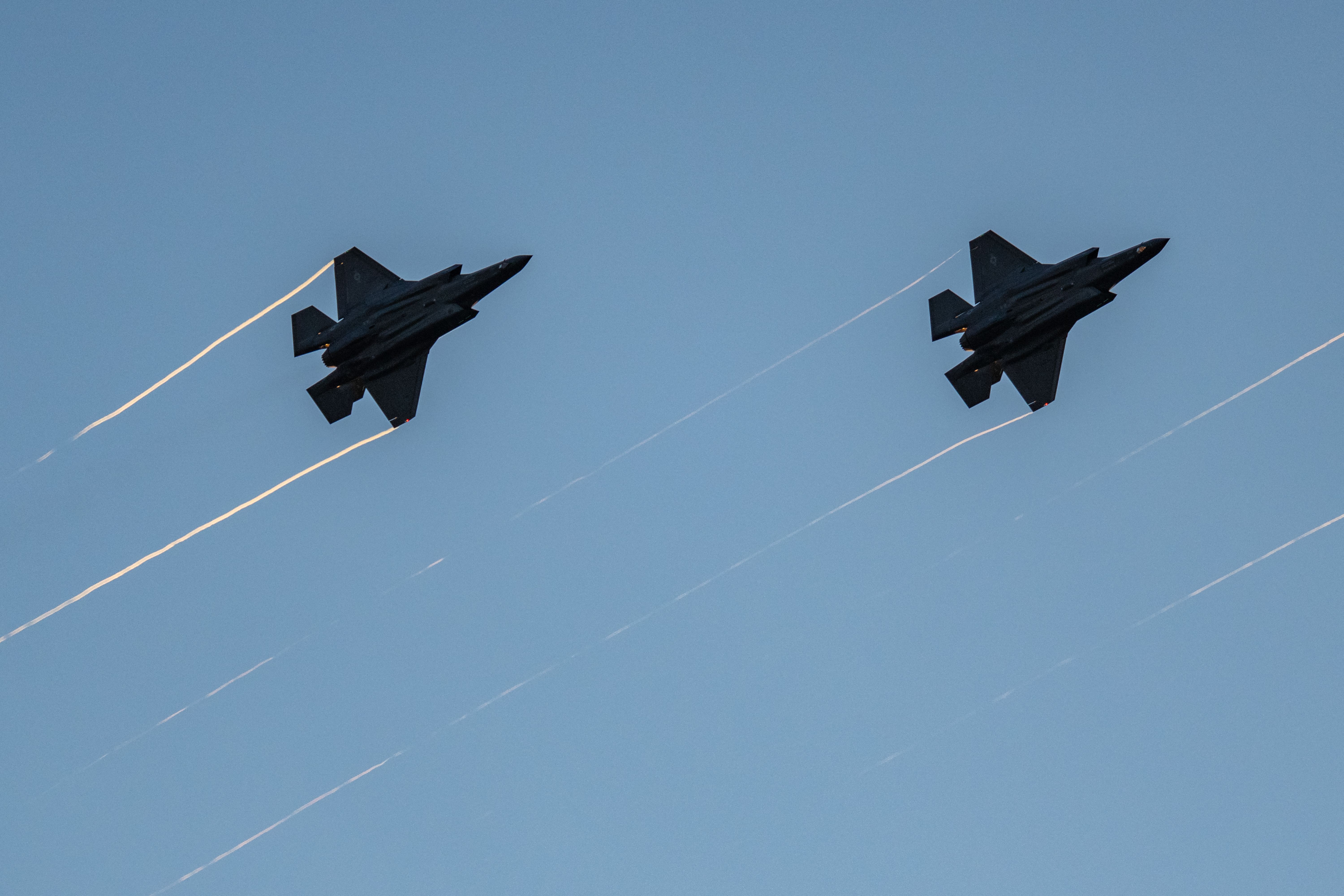 F-35s fly in formation with their afterburners during a kick-off celebration for the "Great American State Fair" on the National Mall in Washington, DC, on June 24.