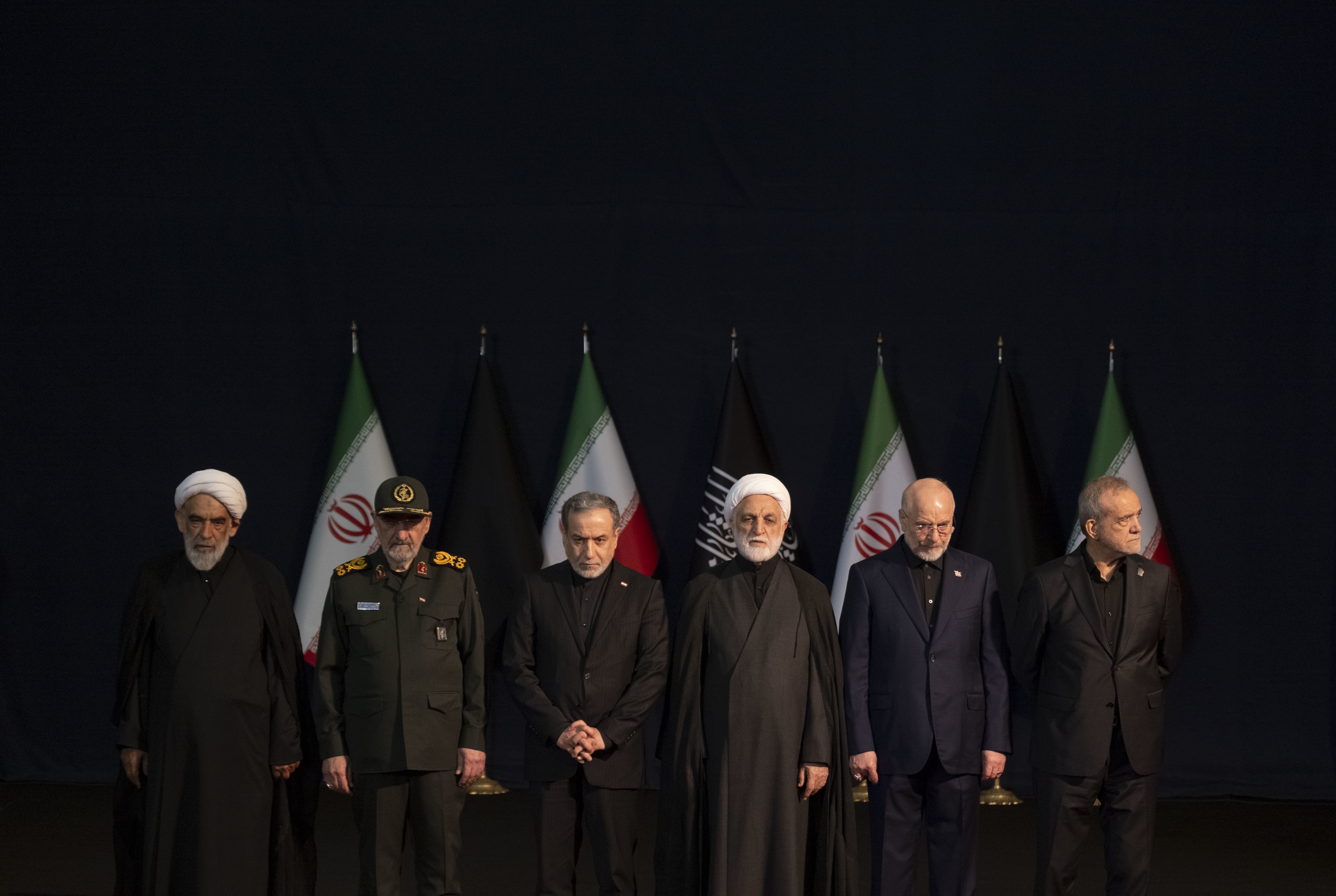 Iranian Parliament Speaker Mohammad Bagher Ghalibaf, Chief Justice of Iran Gholam-Hossein Mohseni-Eje'i, Iranian President Masoud Pezeshkian, Foreign Minister Abbas Araghchi, and an IRGC commander general Mohsen Rezaee arrive to attend a ceremony in Tehran, Iran, on July 3, 2026.