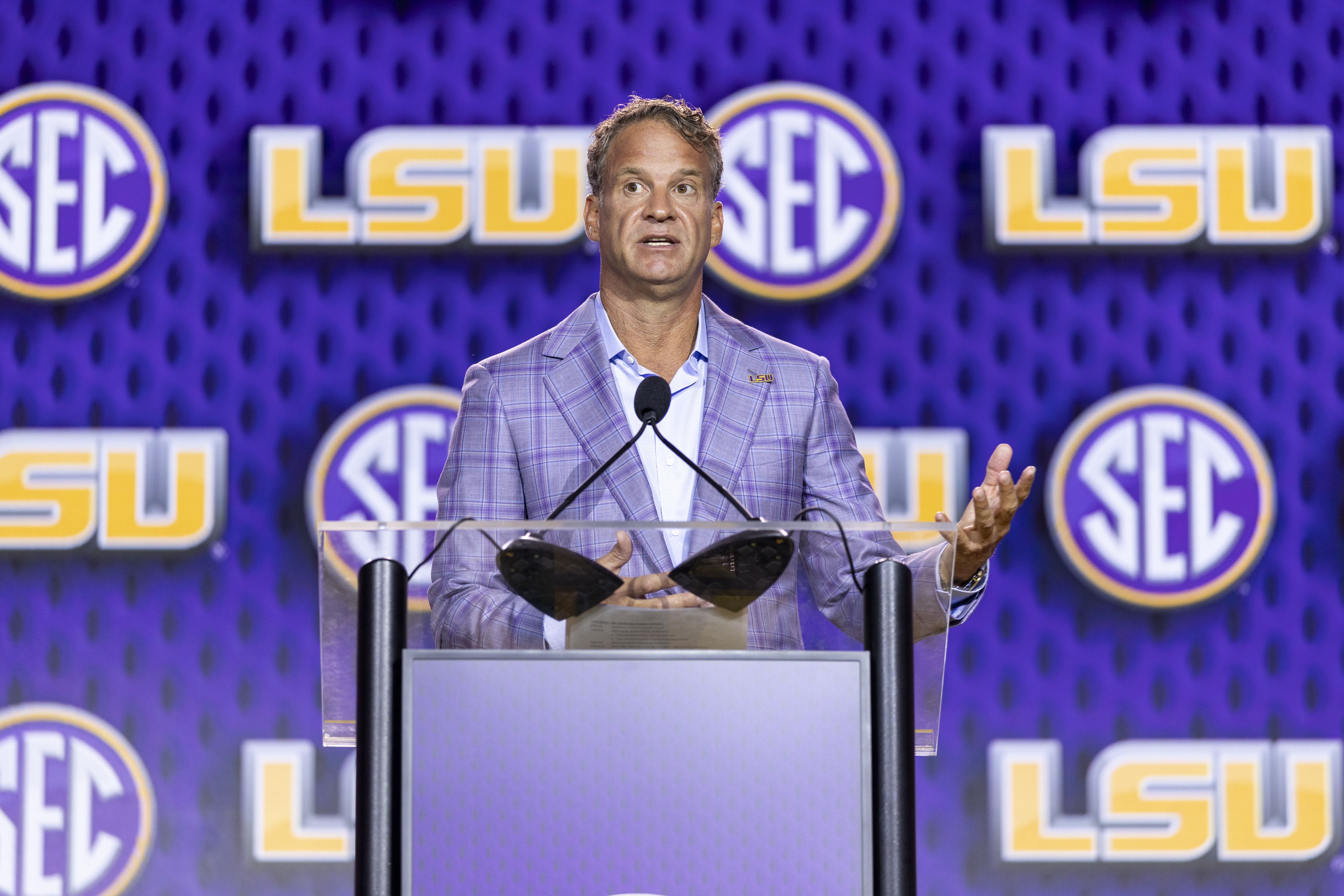 Head Coach Lane Kiffin of the LSU Tigers speaks at SEC Football Kickoff Media Day earlier this summer.