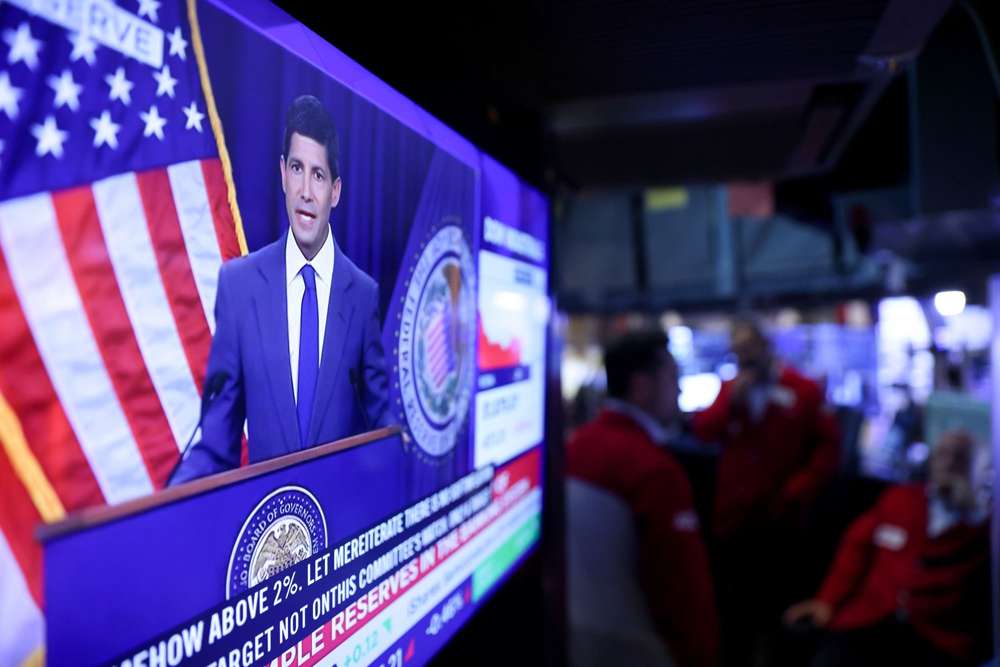 A television station broadcasts Kevin Warsh, chairman of the US Federal Reserve, speaking after a Federal Open Market Committee (FOMC) meeting on the floor of the New York Stock Exchange (NYSE) in New York, US, on Wednesday, July 29, 2026. Federal Reserve officials left interest rates unchanged, but a fractured vote signaled growing conviction among some policymakers that higher rates are needed to curb resurgent inflation.