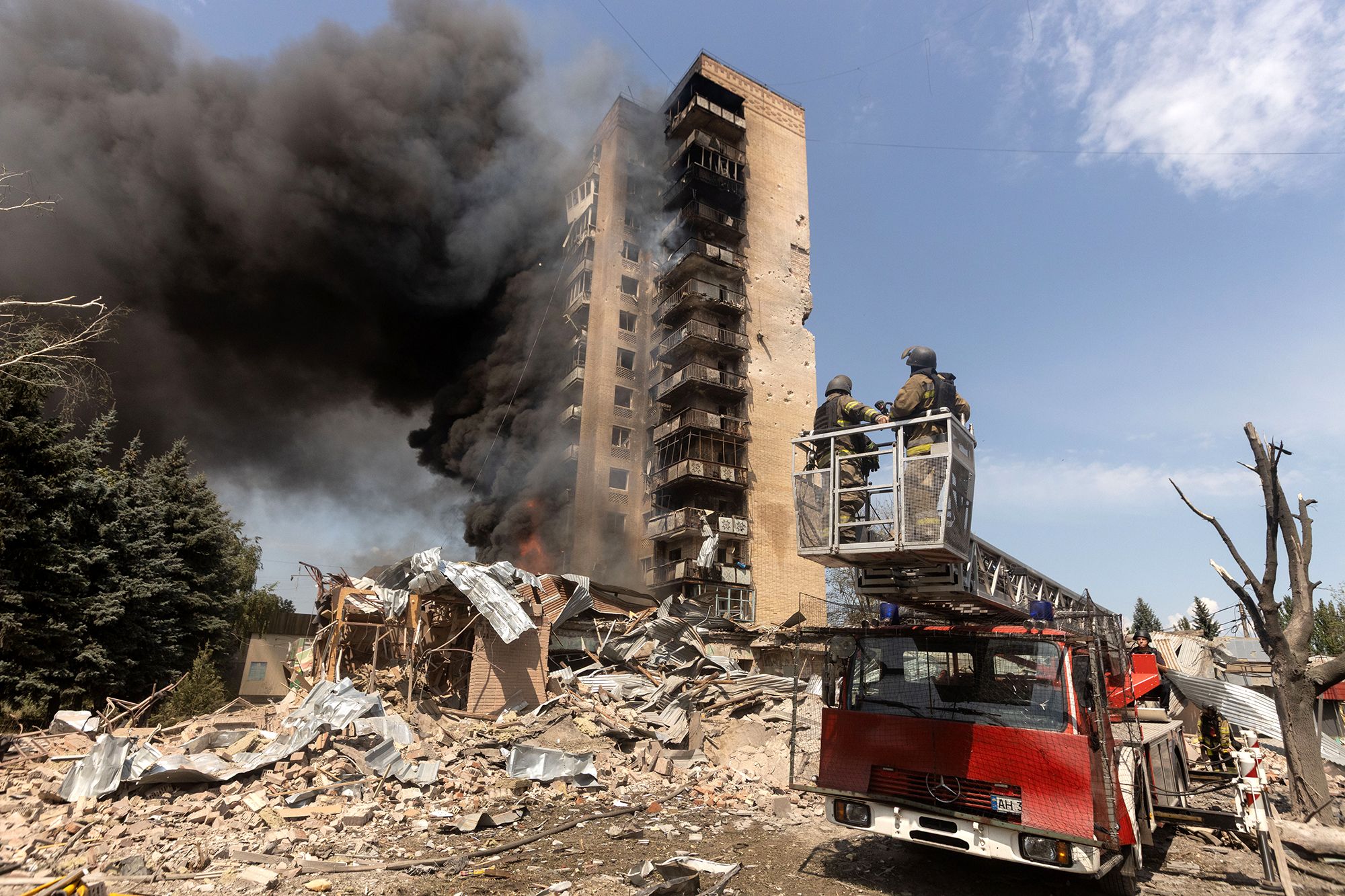 KRAMATORSK, UKRAINE - AUGUST 04: Firefighters operate at a burning building following a Russian airstrike in Kramatorsk, Ukraine, on August 04, 2026. (Photo by Francisco Richart/Anadolu via Getty Images)