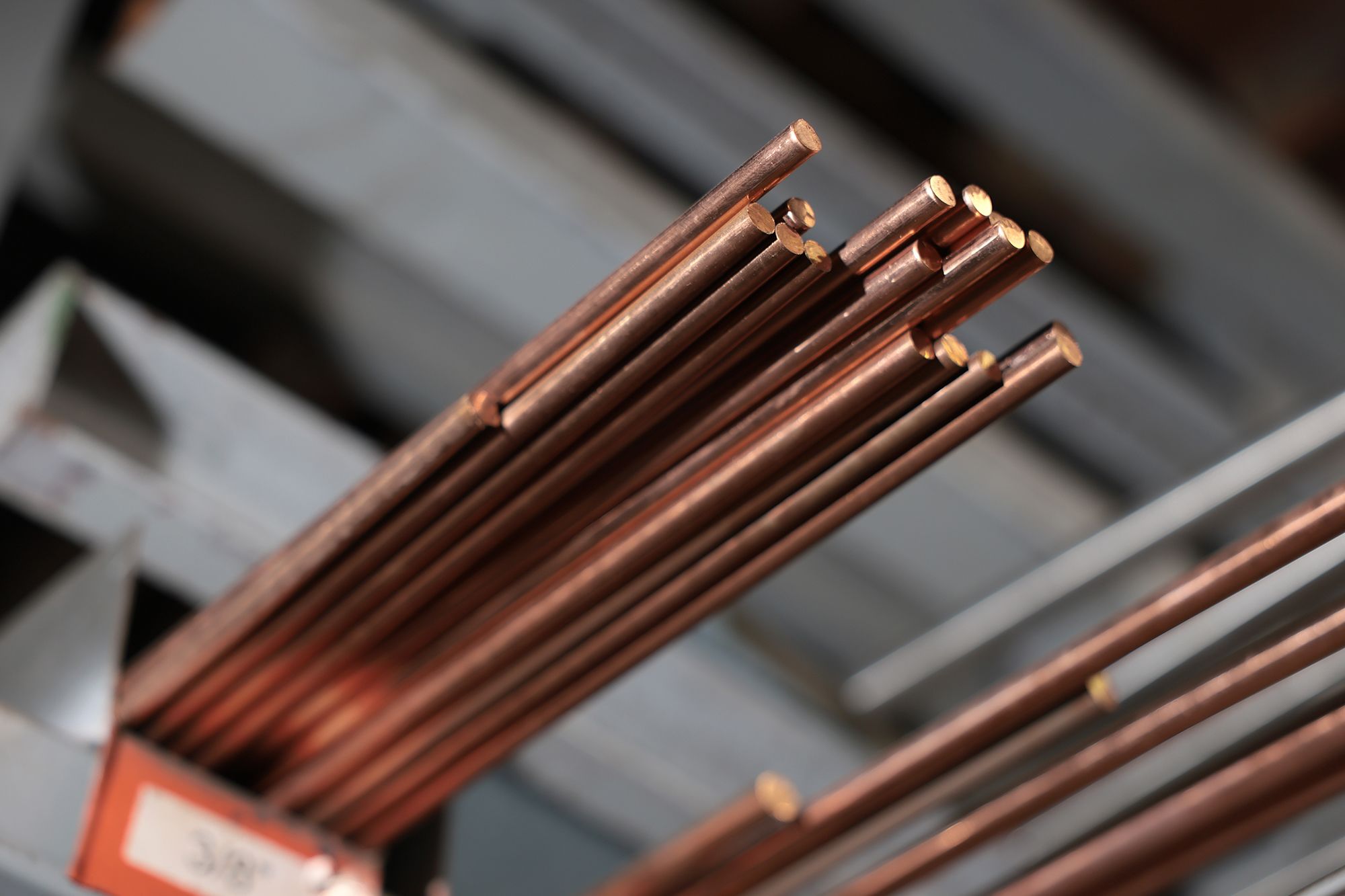 Copper rods sit on the shelf of C & R Metals on August 7, 2026, in Miami. Copper has hit record highs this week.