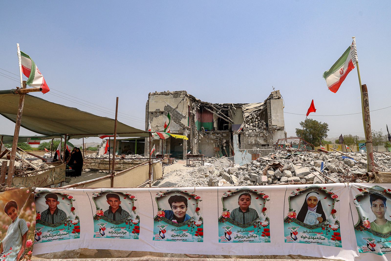 The building of the destroyed Shajareh Tayebeh elementary school, surrounded by rubble in Minab, Iran, on August 10, 2026.