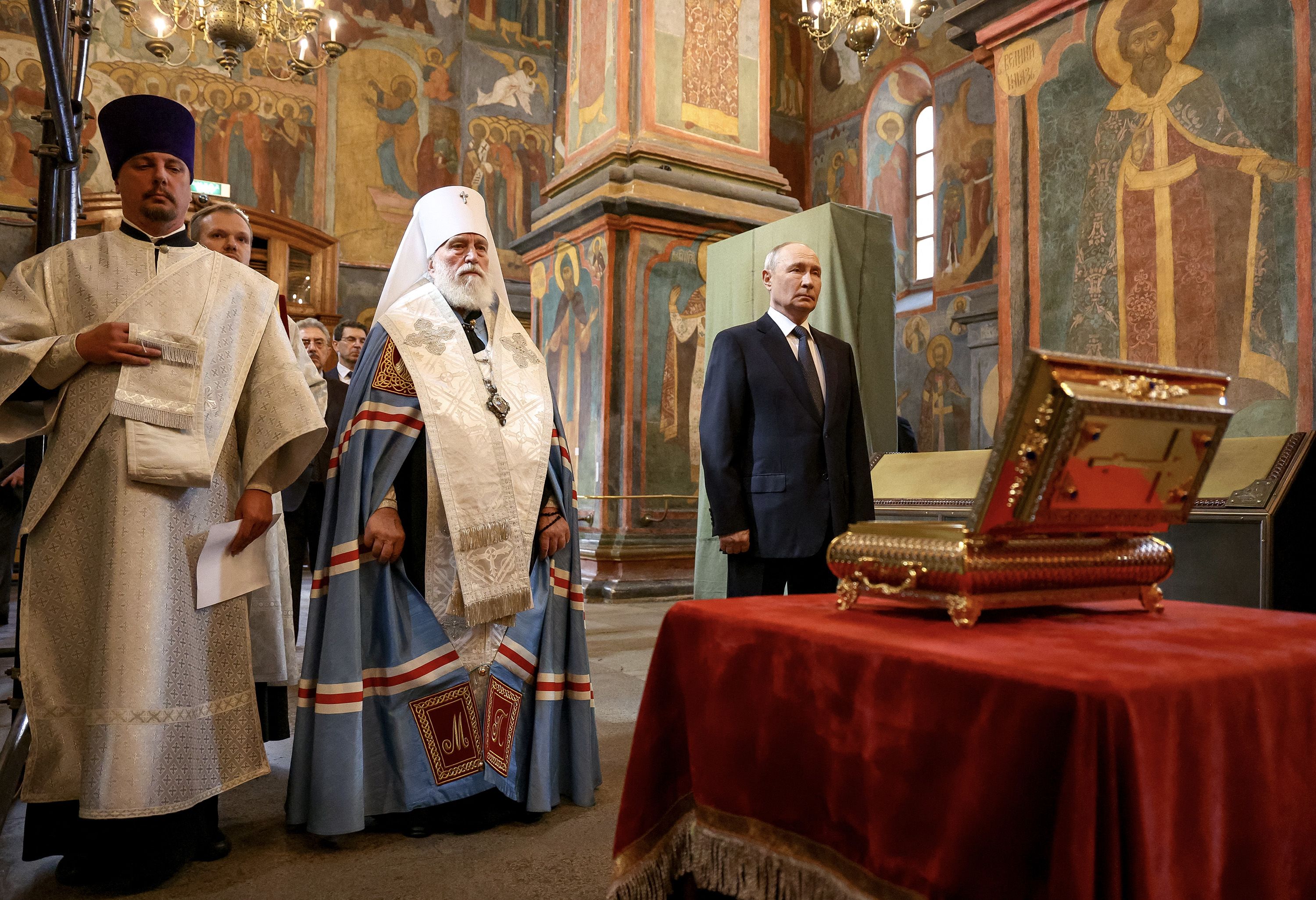 Russian President Vladimir Putin attends a prayer service in the Archangel Cathedral of the Moscow Kremlin, where the remains of a medieval prince were uncovered in August.