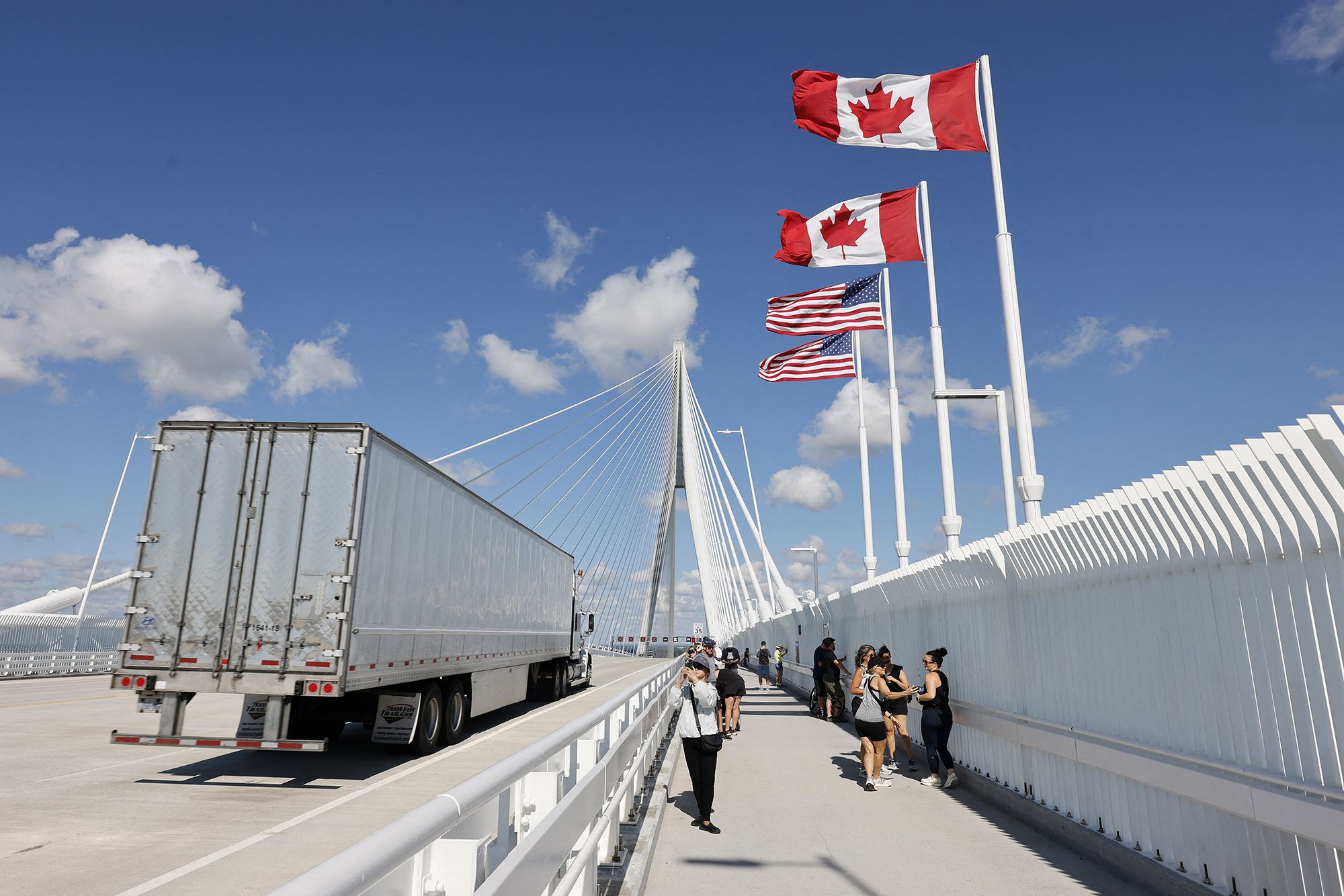 A truck crosses into the United States on the Gordie Howe International Bridge, connecting Windsor, Ontario, and Detroit, Michigan, on September 6, 2025. Canada announced on August 25, 2026 counter-tariffs on US goods ranging between 15 and 50 percent, intensifying the trade war between the historically close allies. Ottawa's retaliation will take effect September 8, a timeframe earlier outlined by Prime Minister Mark Carney after US President Donald Trump's 50-percent duties came into place August 22, 2026.