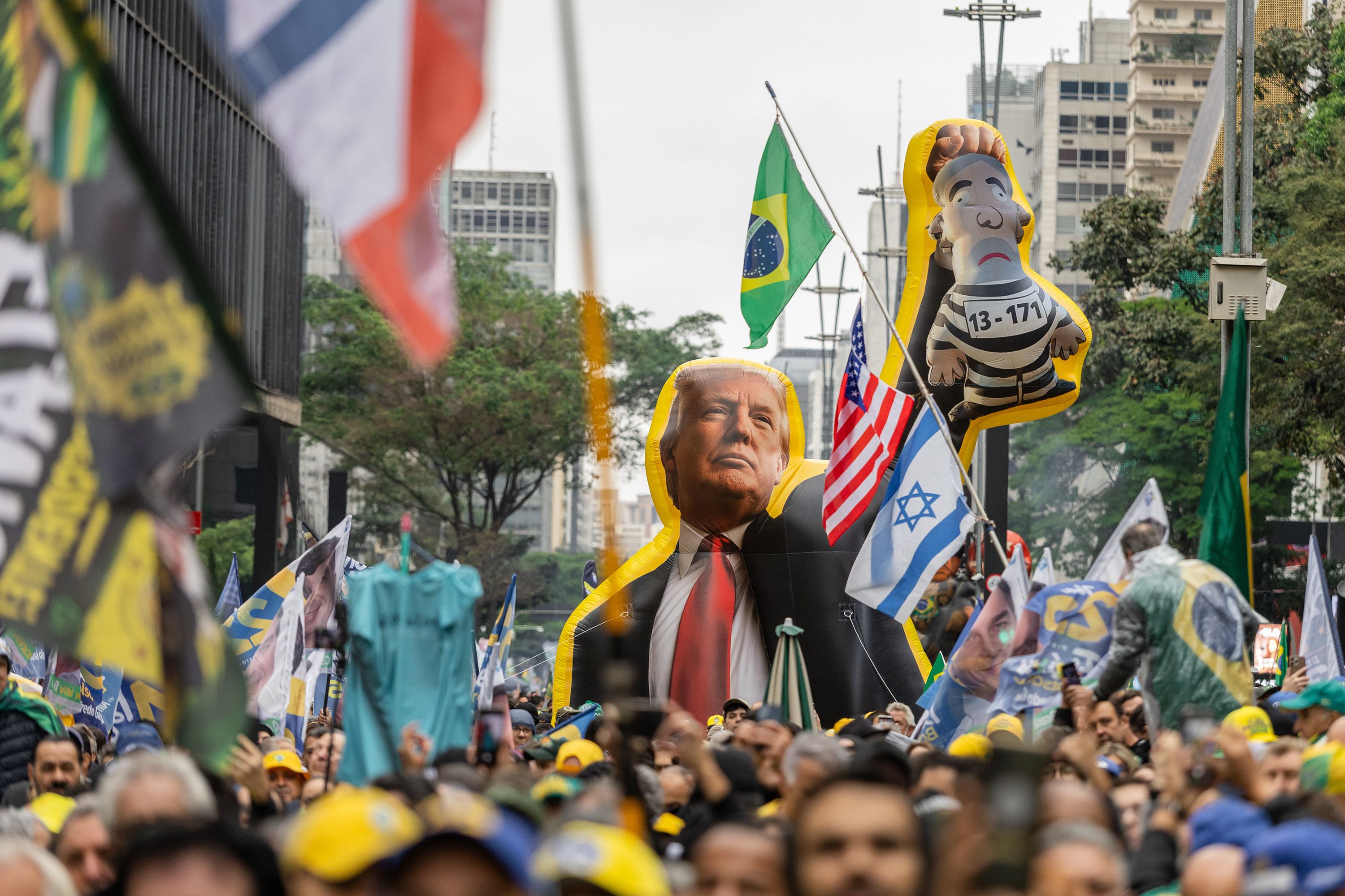 An inflatable in the likeness of US President Donald Trump during an Independence Day campaign rally supporting Flavio Bolsonaro, Brazilian presidential candidate, not pictured, in Sao Paulo, Brazil, on Monday, Sept. 7.