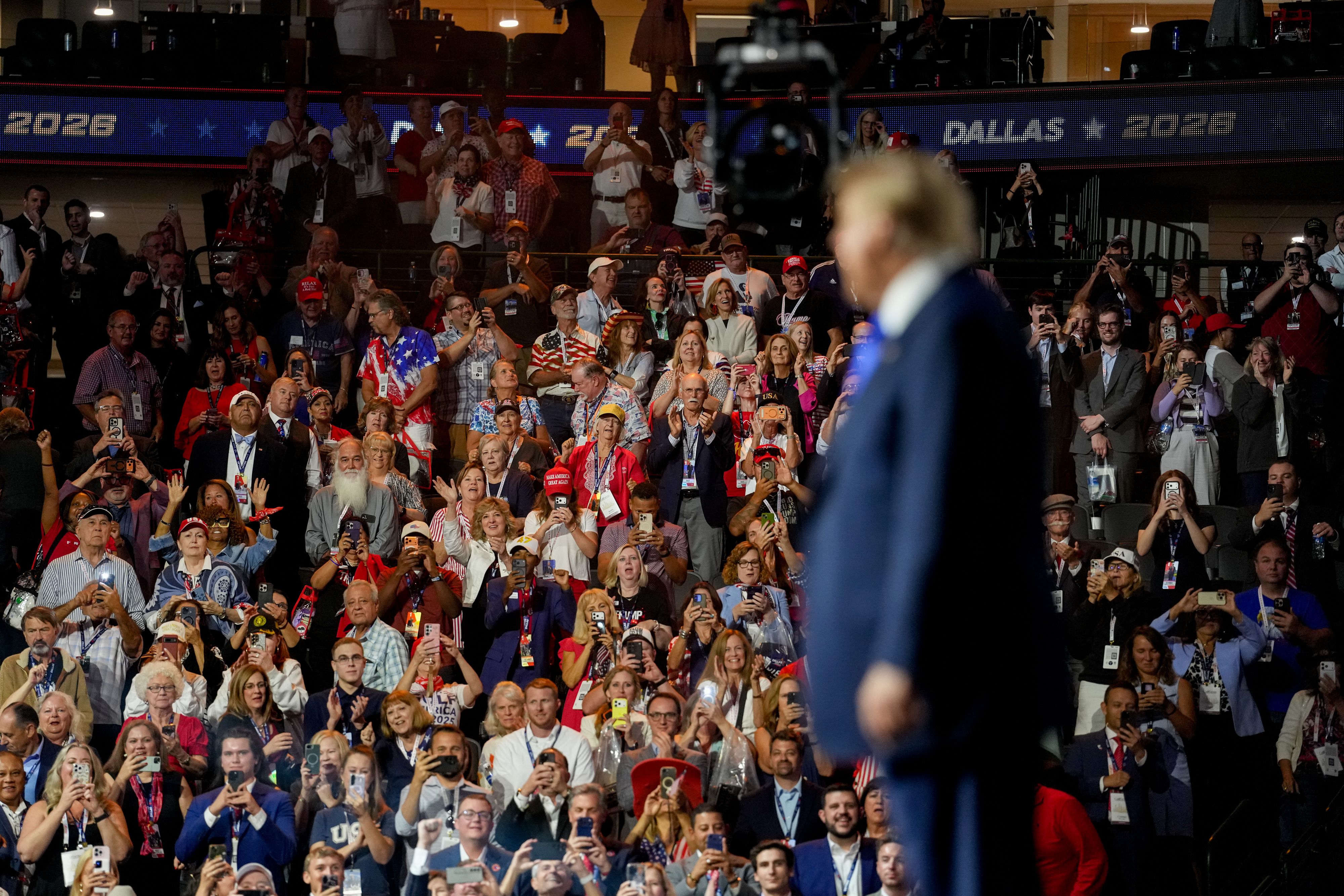Attendees cheers as US President Donald Trump, right, departs after speaking during the first day of the Republican Midterm Convention at the American Airlines Center in Dallas, Texas, on September 9, 2026.