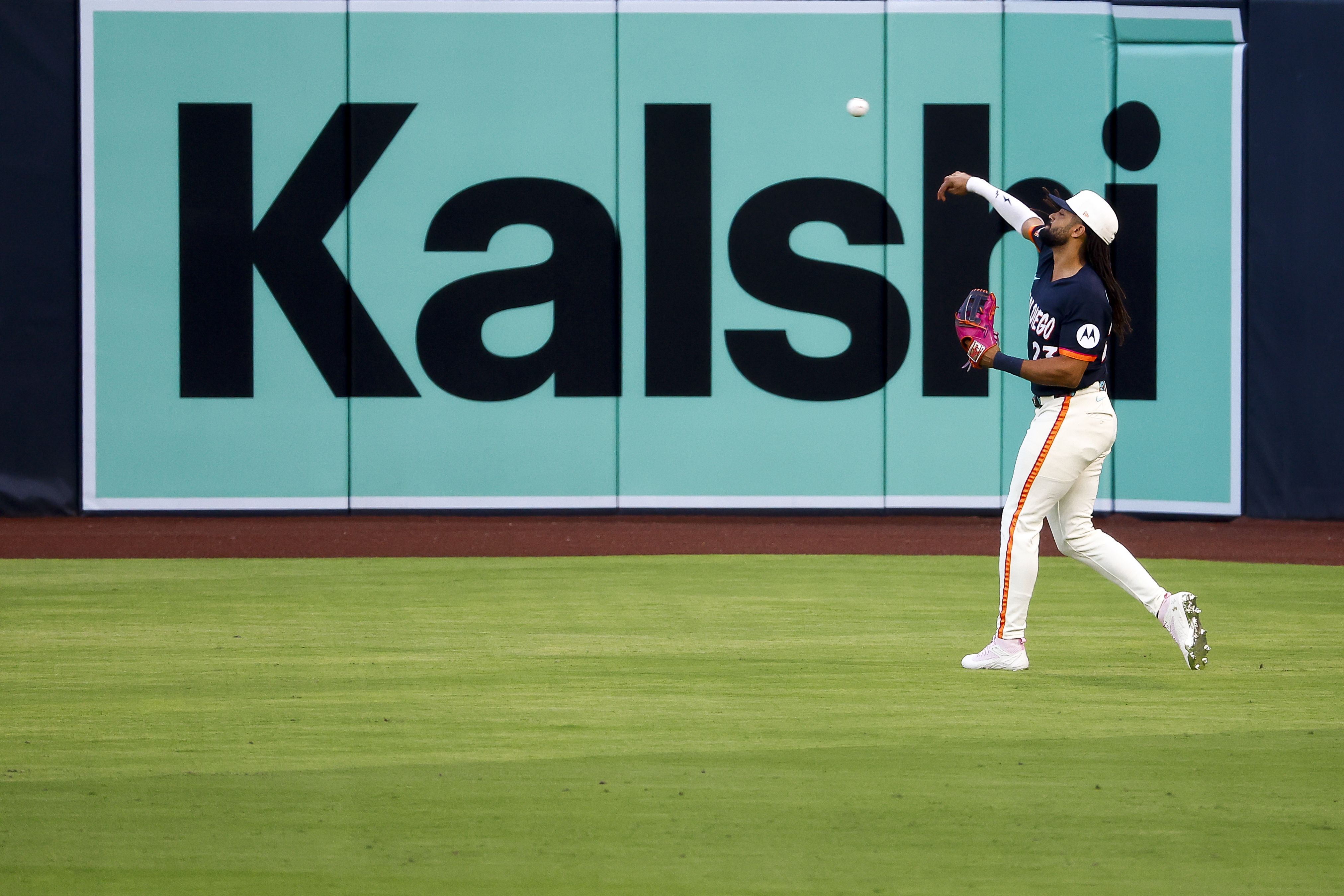 San Diego, California - September 04: Fernando Tatis Jr. #23 of the San Diego Padres throws the ball in front of a Kalshi ad before the game against the New York Yankees at Petco Park on Friday, Sept. 4, 2026 in San Diego, California. (Photo by Meg McLaughlin / The San Diego Union-Tribune via Getty Images)