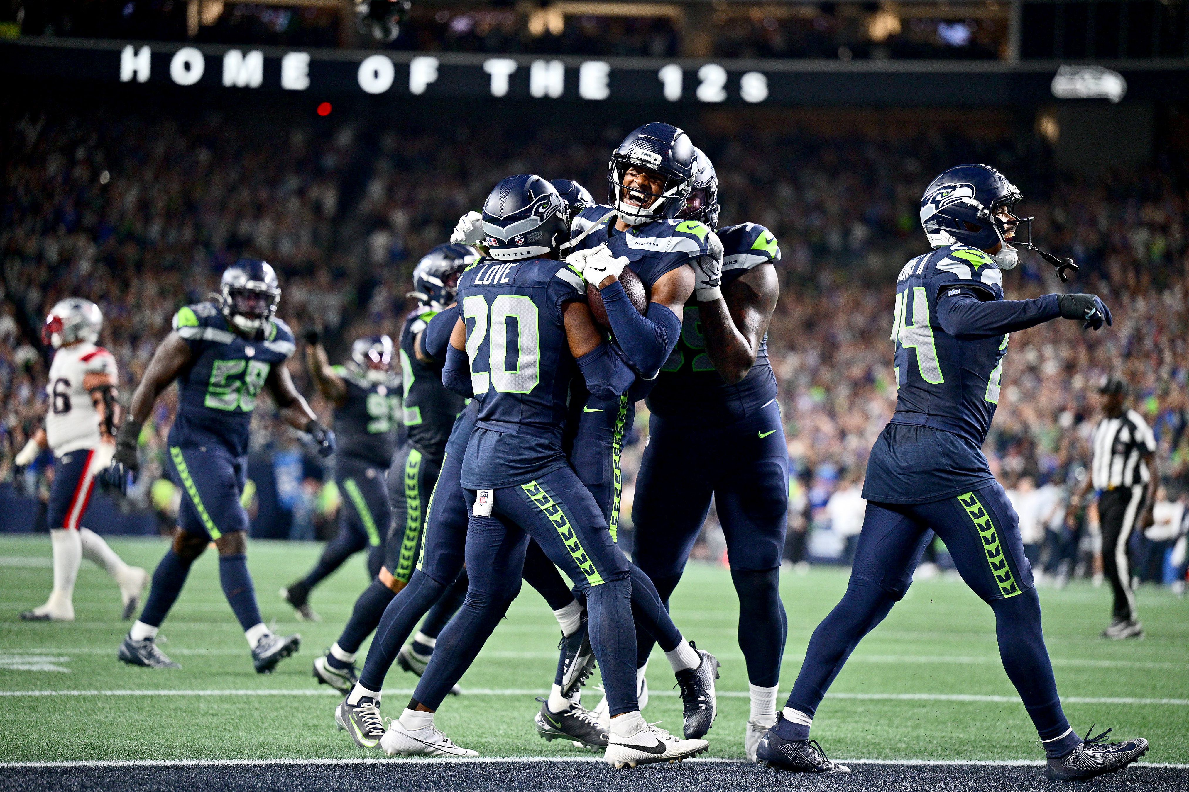 Josh Jobe celebrates with Seattle Seahawk teammates after intercepting a pass in the end zone to win the game on Wednesday.