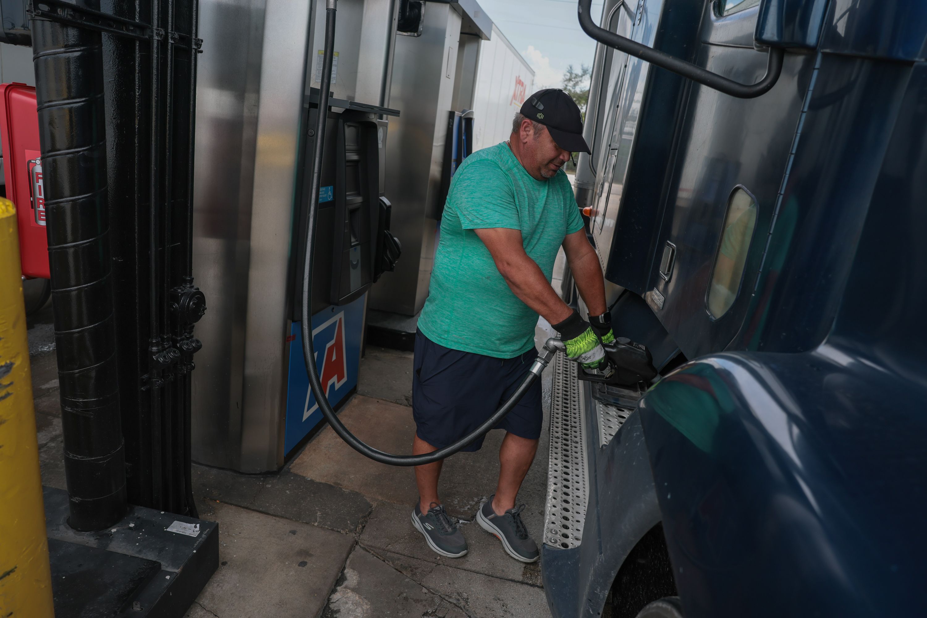 A person pumps diesel fuel into his tractor-trailer at a truck stop on September 11, 2026, in Miami.