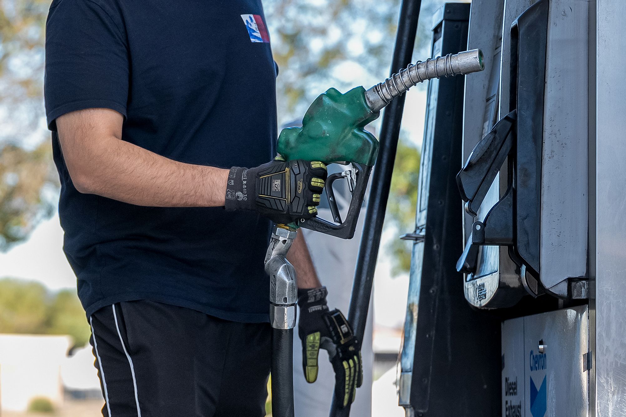 A driver returns a fuel nozzle after refueling a tractor trailer with diesel fuel at a Chevron truck stop in Tracy, California, US, on Friday, Sept. 11, 2026. US diesel prices rose above $6 a gallon for the first time ever, raising the risk of further energy-driven inflation just ahead of peak demand season for the fuel. Photographer: David Paul Morris/Bloomberg via Getty Images