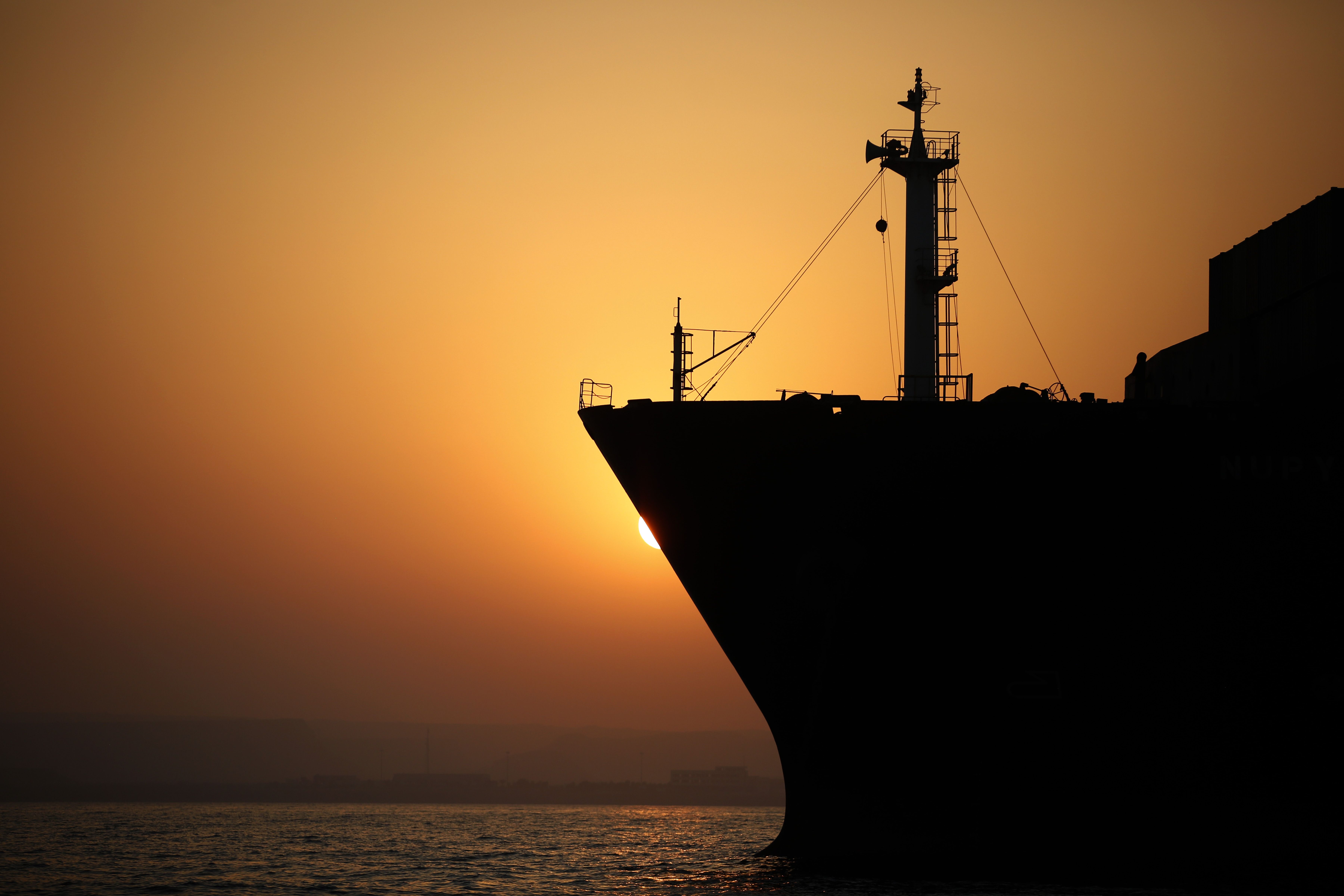 Commercial vessels are seen anchored between Iran's Qeshm and Larak islands amid disruptions to marine traffic through the Strait of Hormuz on September 11.