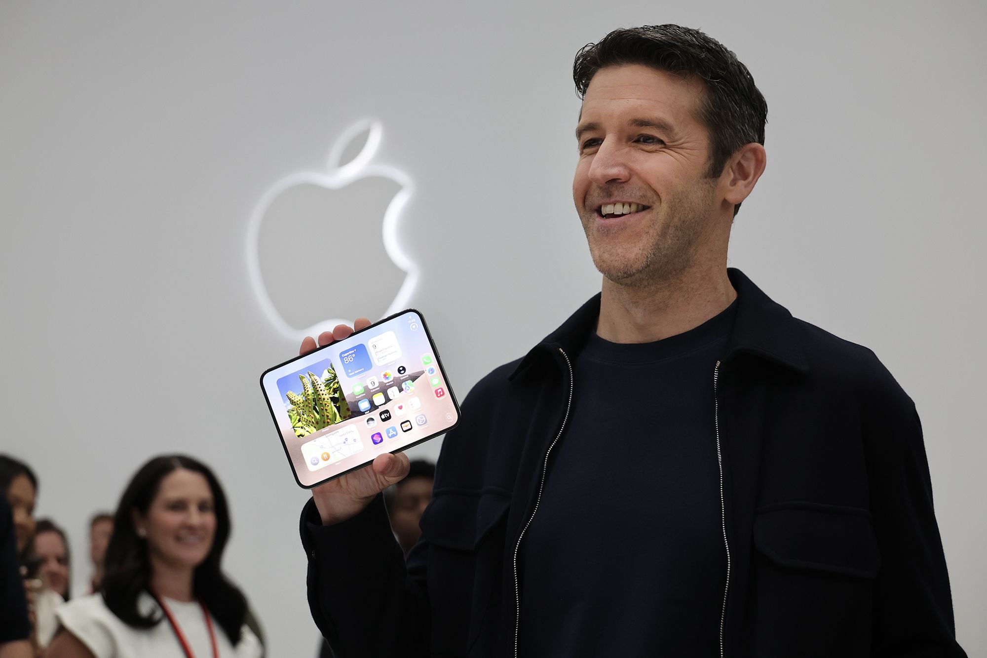 Apple CEO John Ternus holds the iPhone Duo during Apple’s “Surprise and Shine” event at the company's corporate headquarters, Apple Park, on September 9, 2026 in Cupertino, California. The event featured Apple product announcements and was Apple CEO John Ternus’s first keynote address in his new role.