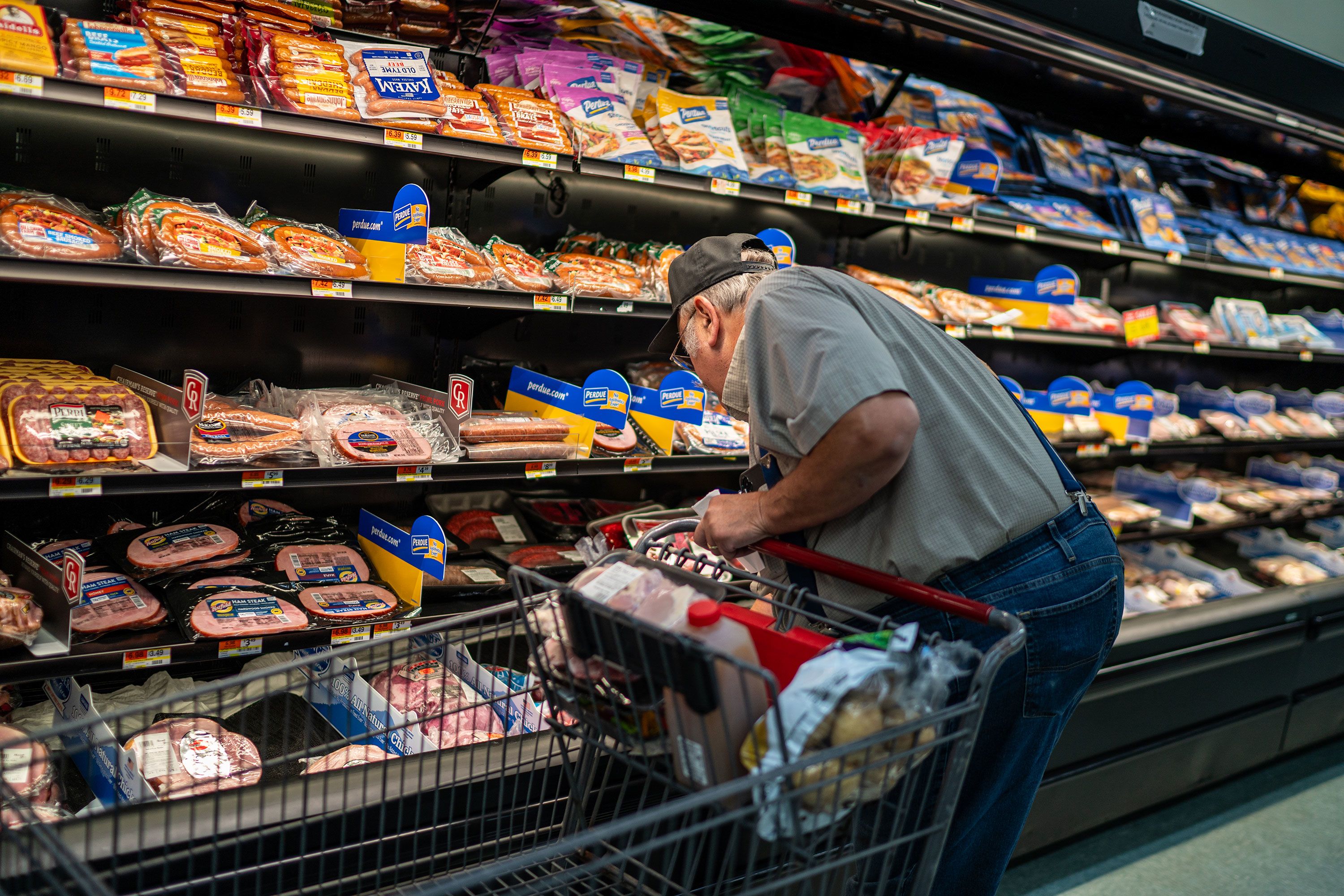 A shopper searches for meat products at a supermarket in Colebrook, New Hampshire, on September 13.