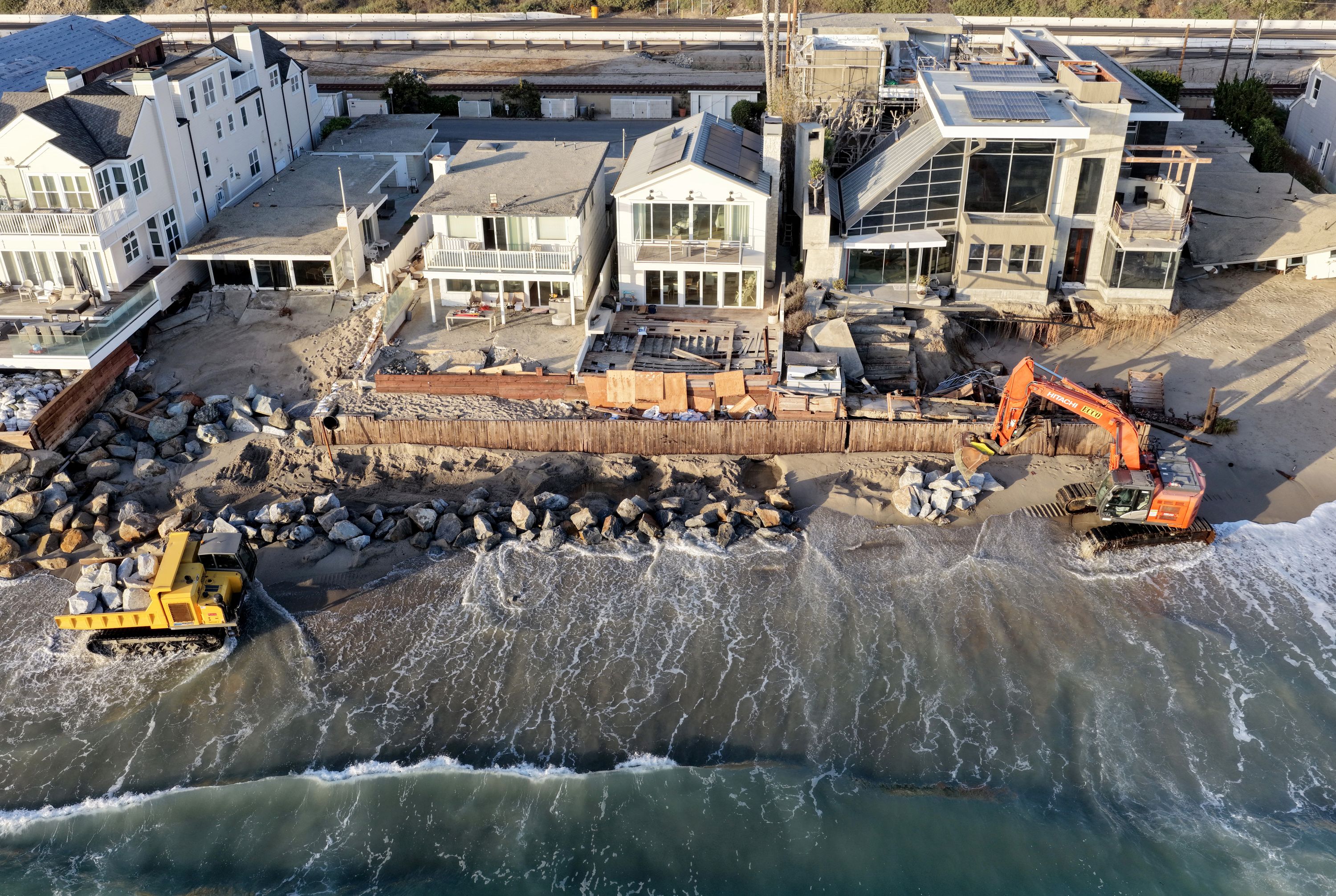 Crews move boulders into place to protect beachfront homes in Dana Point, California, on September 14. Waves generated by intense Pacific storm systems, their heights amplified by El Niño, could erode parts of the fragile coastline.