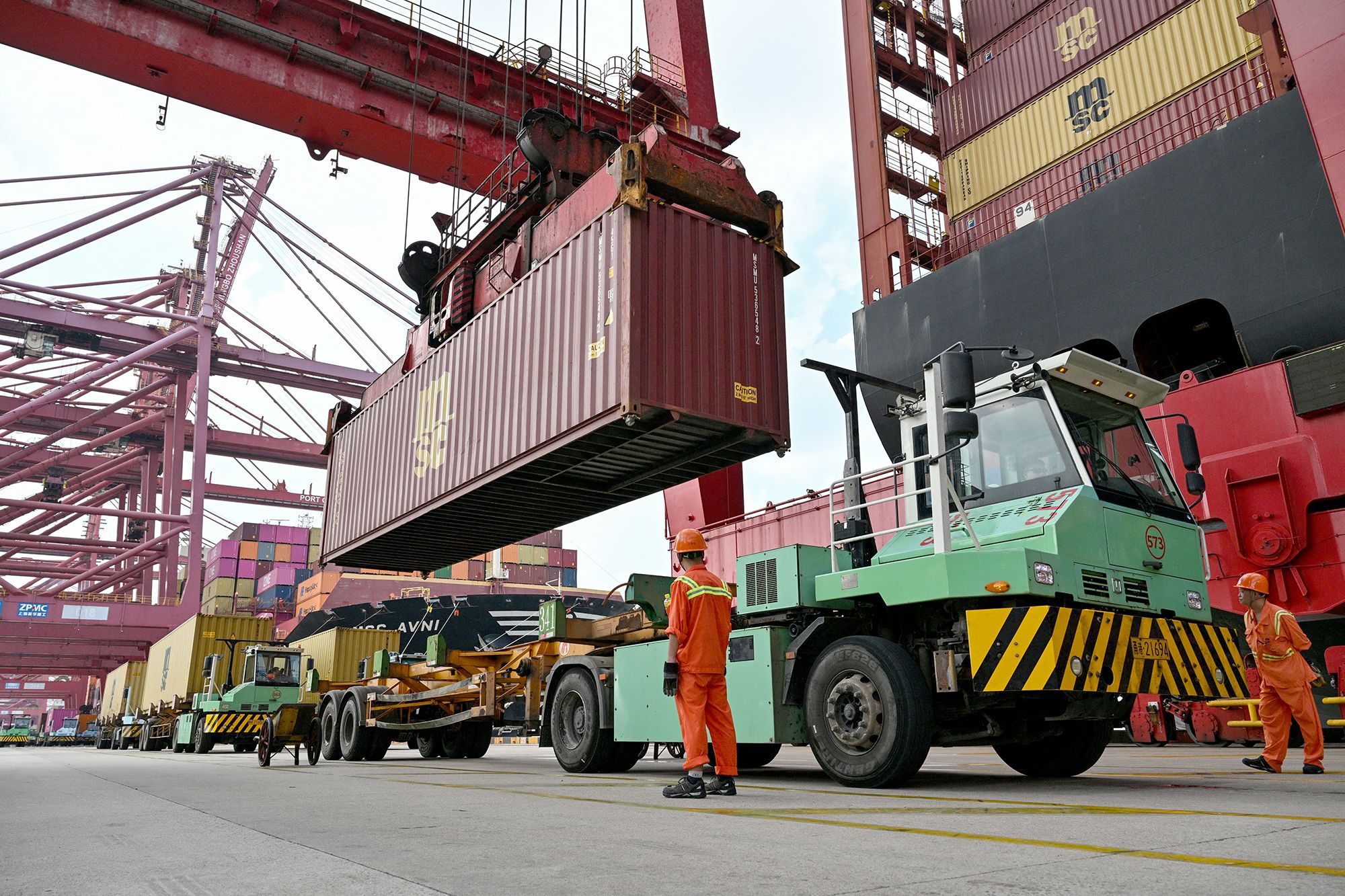 Cranes load containers onto a ship at the Port of Ningbo-Zhoushan in Ningbo, in China's eastern Zhejiang Province on September 22, 2026. (Photo by Hector RETAMAL / AFP via Getty Images)