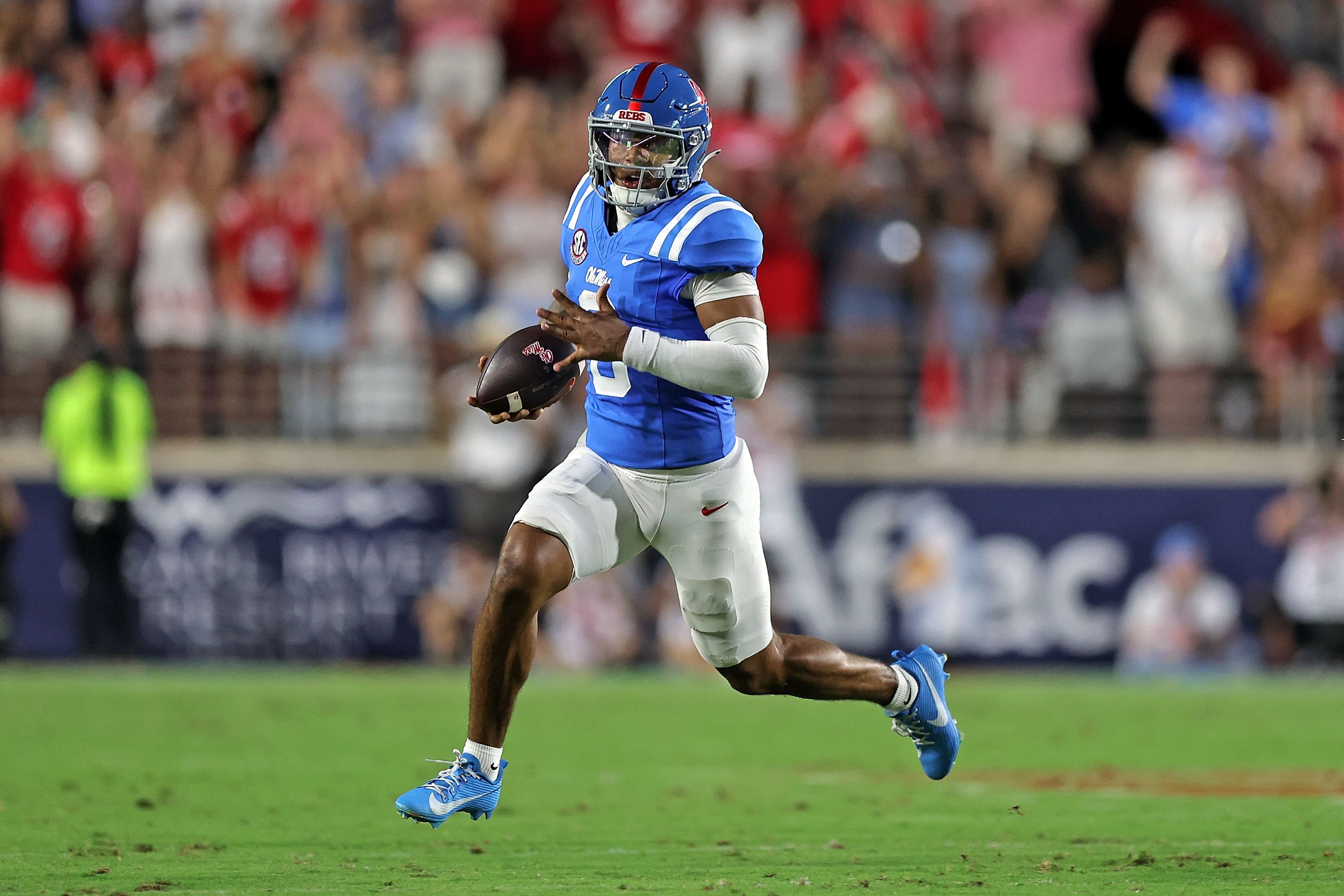 Trinidad Chambliss #6 of the Mississippi Rebels carries the ball during the first half against the Louisiana State Tigers at Vaught-Hemingway Stadium in Oxford, Mississippi, on September 19, 2026. (Photo by Justin Ford/Getty Images)