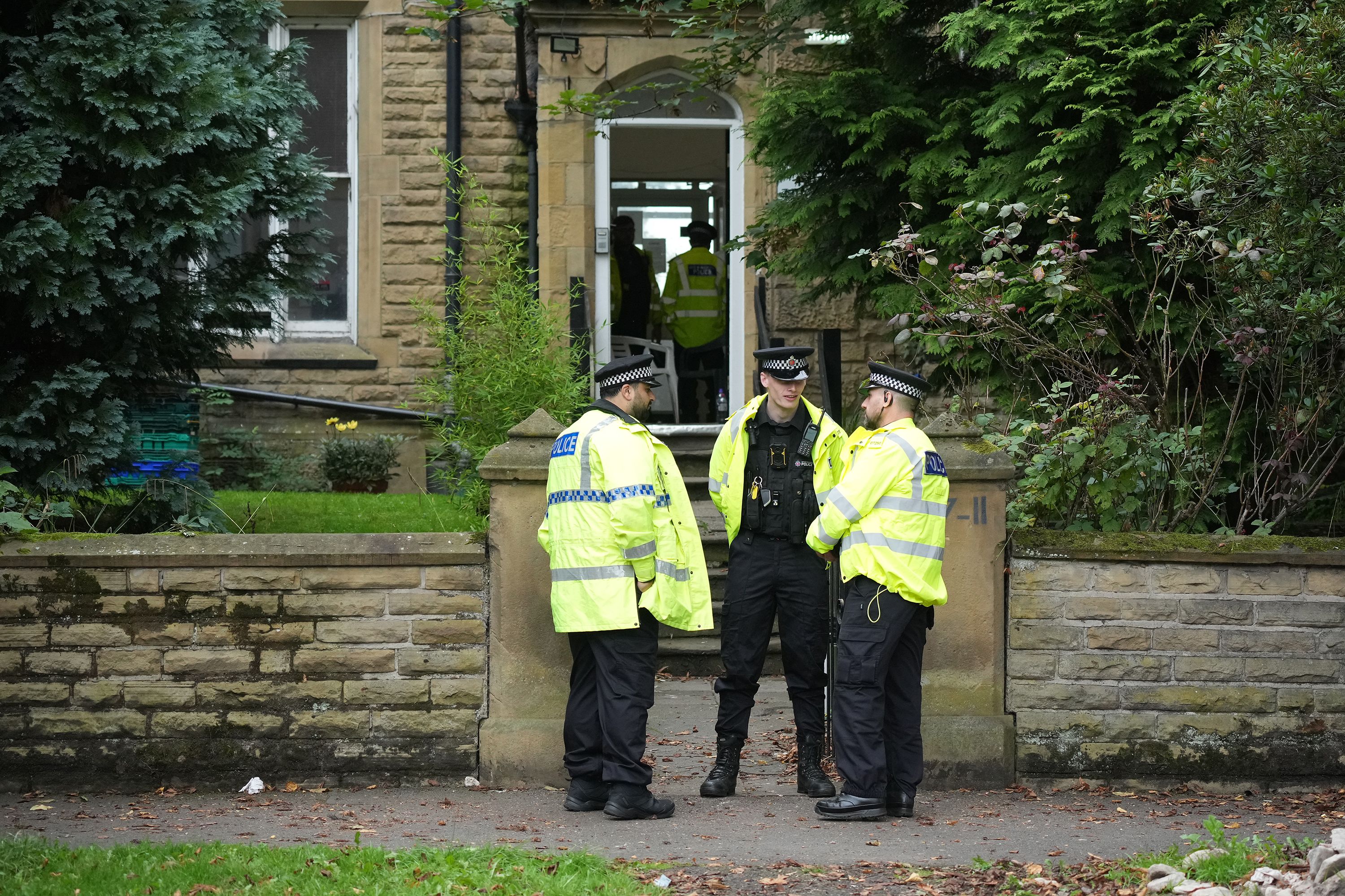 Police attend an address in Manchester on September 21, a day after two counter-terror arrests were made.