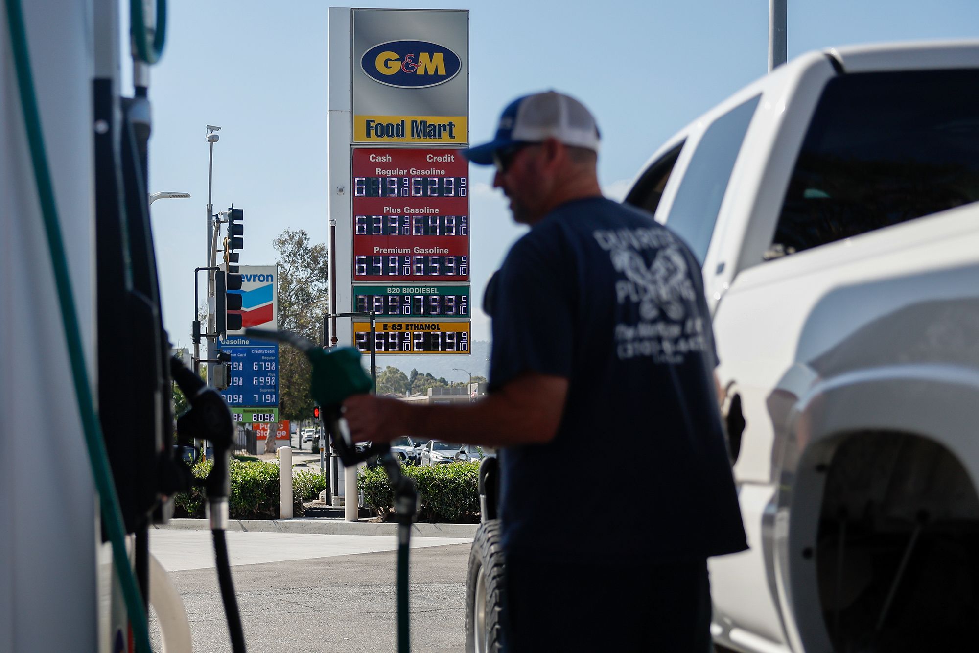 A sign displays the prices of unleaded gasoline and diesel fuel as a driver refuels a vehicle with diesel fuel at a G&M gas station in Torrance, California, US, on Monday, Sept. 28, 2026. A potential US ban on diesel exports would slash domestic prices for the fuel at the outset, but the effect is likely to be short-lived, according to executives, traders and analysts. Photographer: Caroline Brehman/Bloomberg via Getty Images