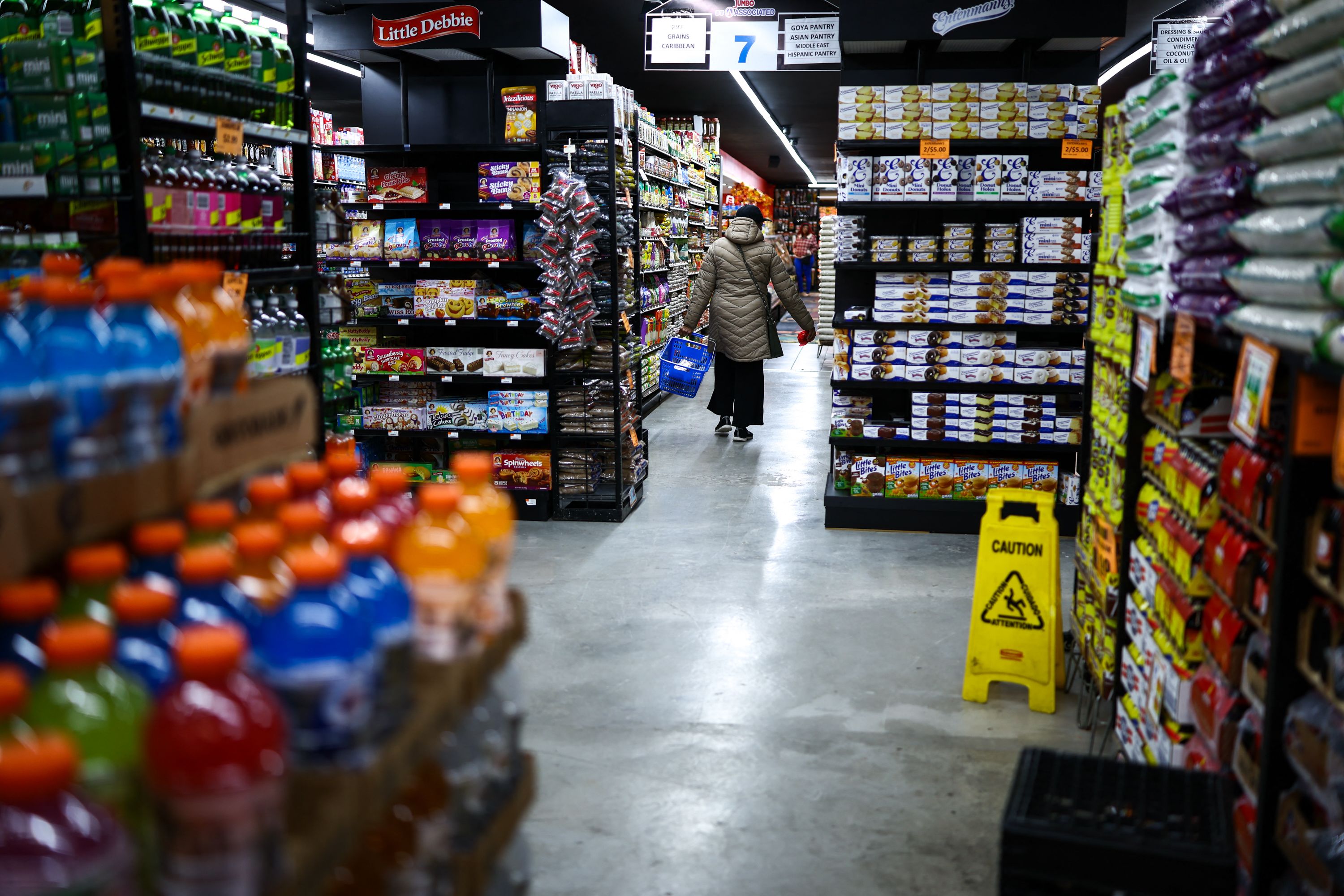 A customer walks down the aisle in a supermarket in the Sugar Hill neighborhood of Manhattan in New York on September 28, 2026. (Photo by CHARLY TRIBALLEAU / AFP via Getty Images)