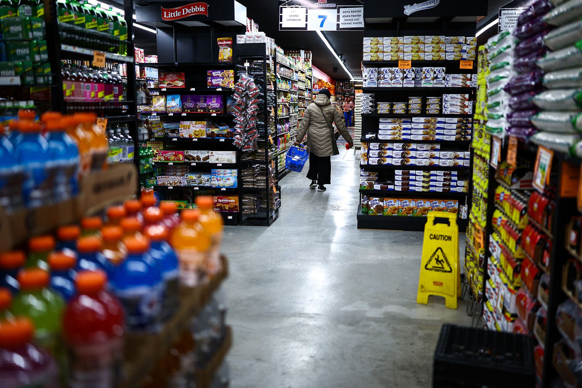 A customer walks down the aisle in a supermarket in the Sugar Hill neighborhood of Manhattan in New York on September 28, 2026.