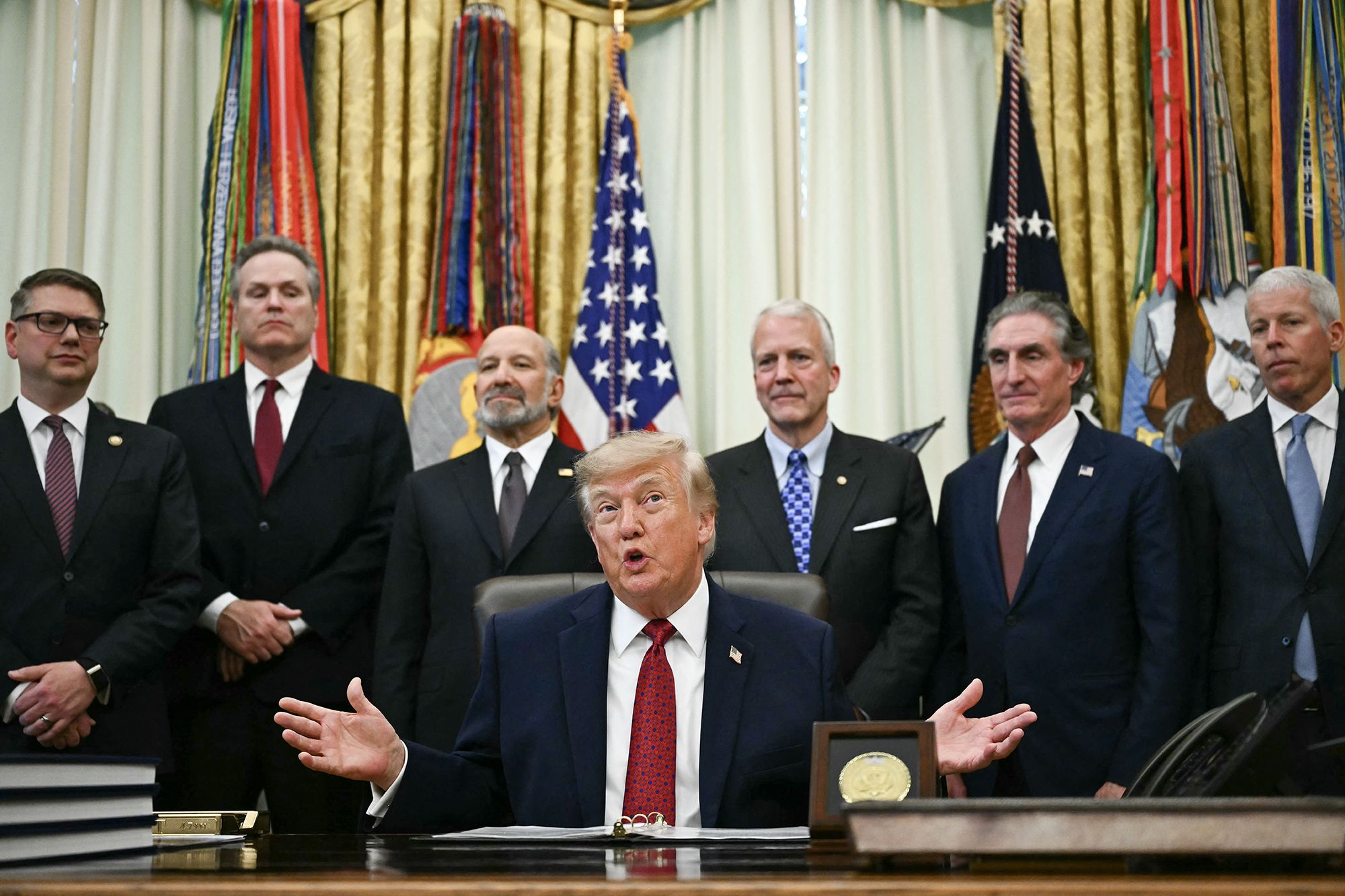 US President Donald Trump makes an announcement with US Secretary of Commerce Howard Lutnick (3L) in the Oval Office of the White House in Washington, DC, on September 30, 2026. Also picture, US Senator Dan  Sullivan (3R), Republican from Alaska, US Secretary of the Interior Doug Burgum (2R) and US Secretary of Energy Chris Wright (R). (Photo by Kent NISHIMURA / AFP via Getty Images)