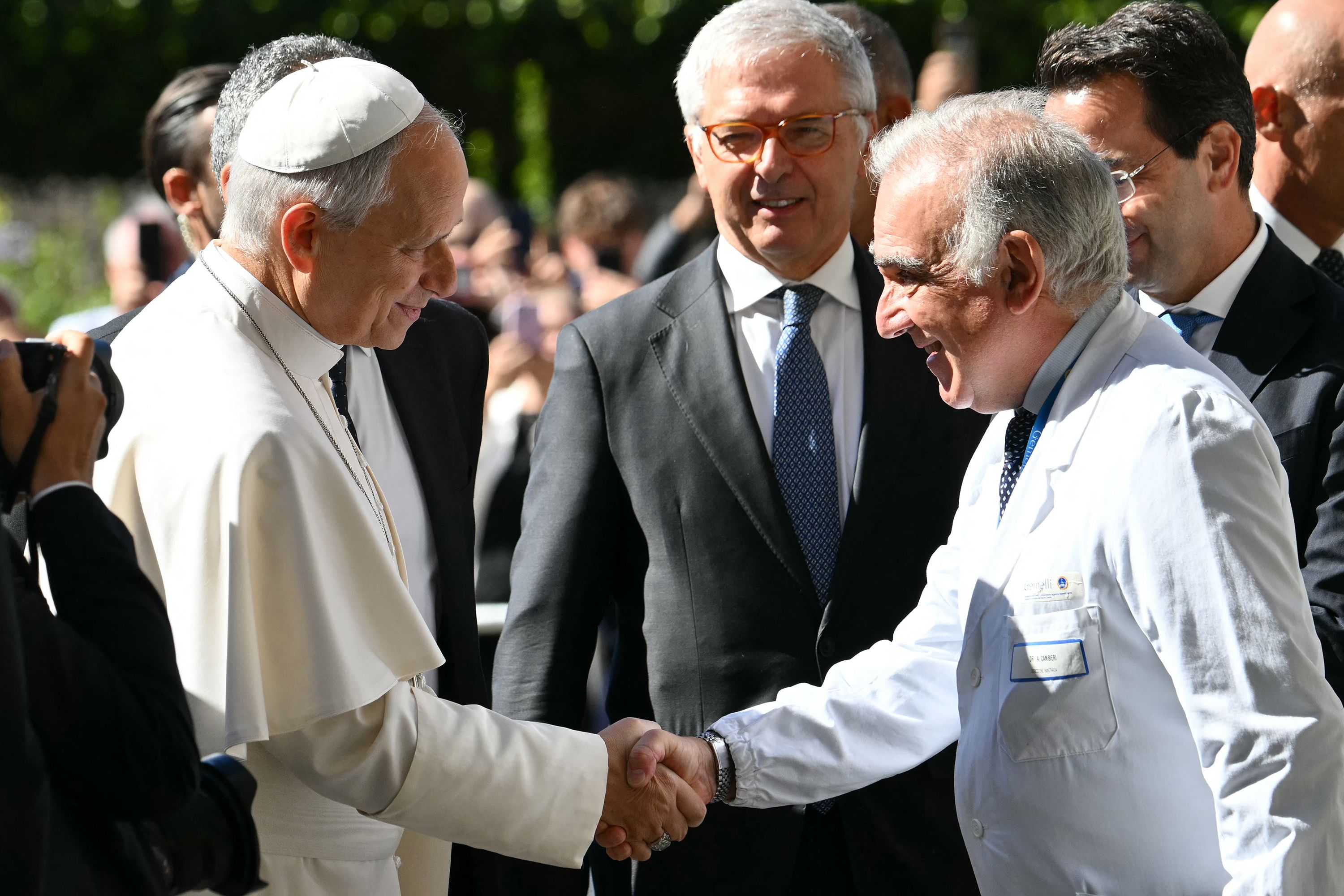 Pope Leo XIV is welcomed by Health Director Andrea Cambieri as he arrives at the Gemelli University Hospital for an operation to remove a lump from his lung, in Rome, on October 13.