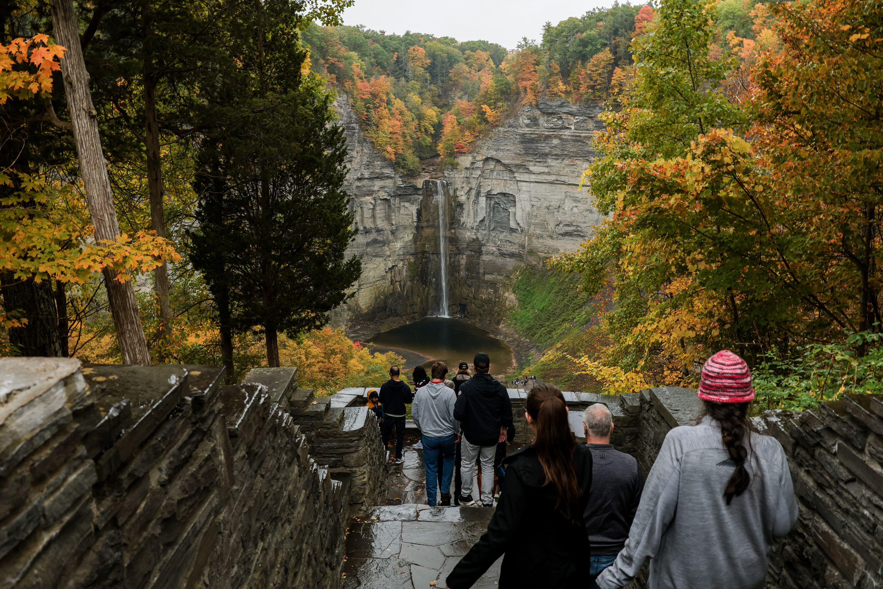 ITHACA, NEW YORK - OCTOBER 11: People visit the Taughannock Falls State Park on October 11, 2026 in Ithaca, New York. The Northeast up through New England are expected to see vibrant fall foliage this season. (Photo by Anna Moneymaker/Getty Images)