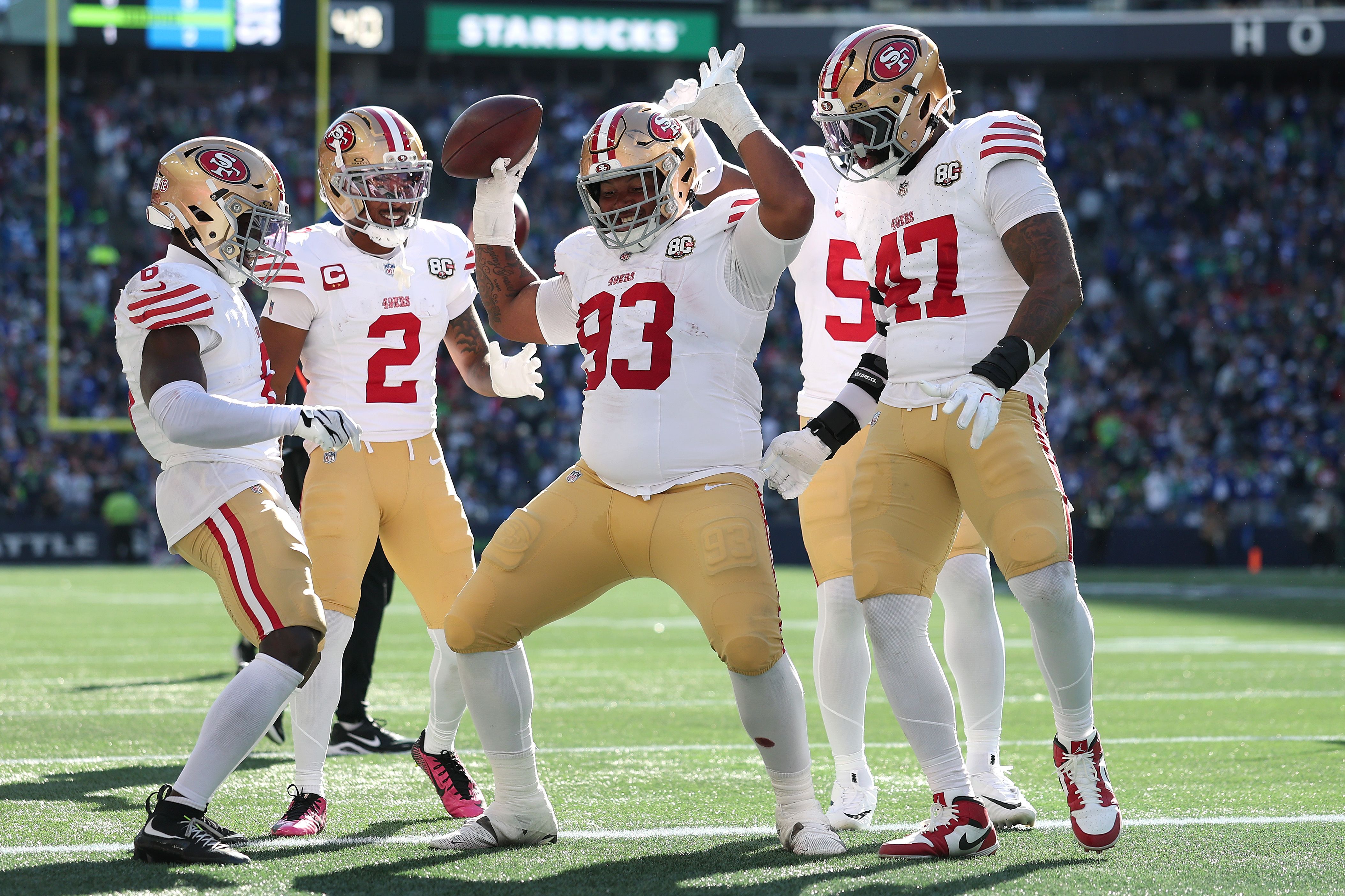 Gracen Halton, a rookie defensive lineman for the San Francisco 49ers, celebrates his touchdown against the Seattle Seahawks on Sunday.