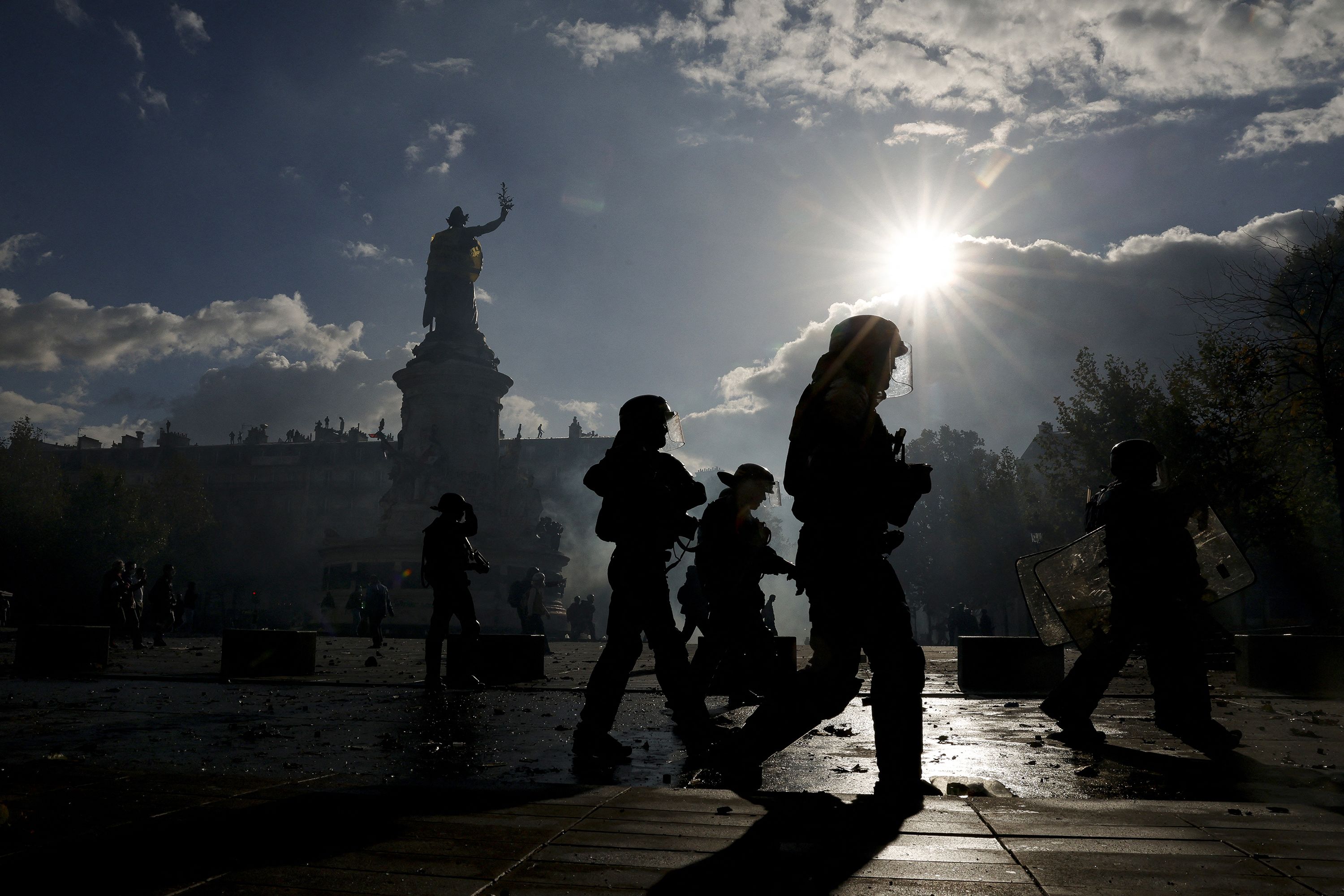 Police officers patrol on Place de la Republique during a demonstration to protest against the "high cost of living", in Paris on October 17.