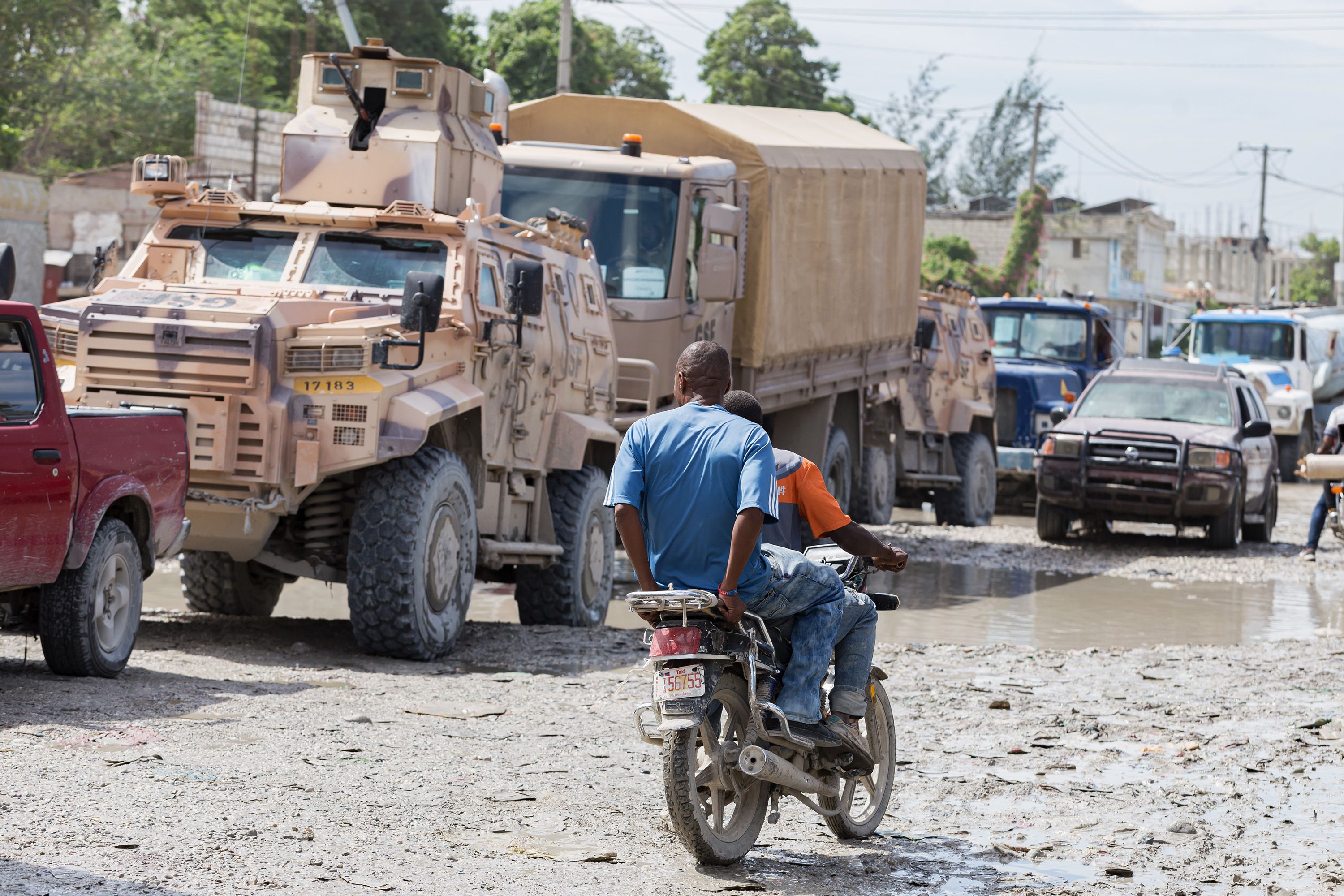 Gang Suppression Force (GSF) vehicles are seen in a traffic jam in downtown Port-au-Prince, Haiti, on October 24, 2026. Approximately 450 Salvadoran soldiers have arrived in the Haitian capital to reinforce the GSF and take part in search operations for four missing Salvadoran nationals.