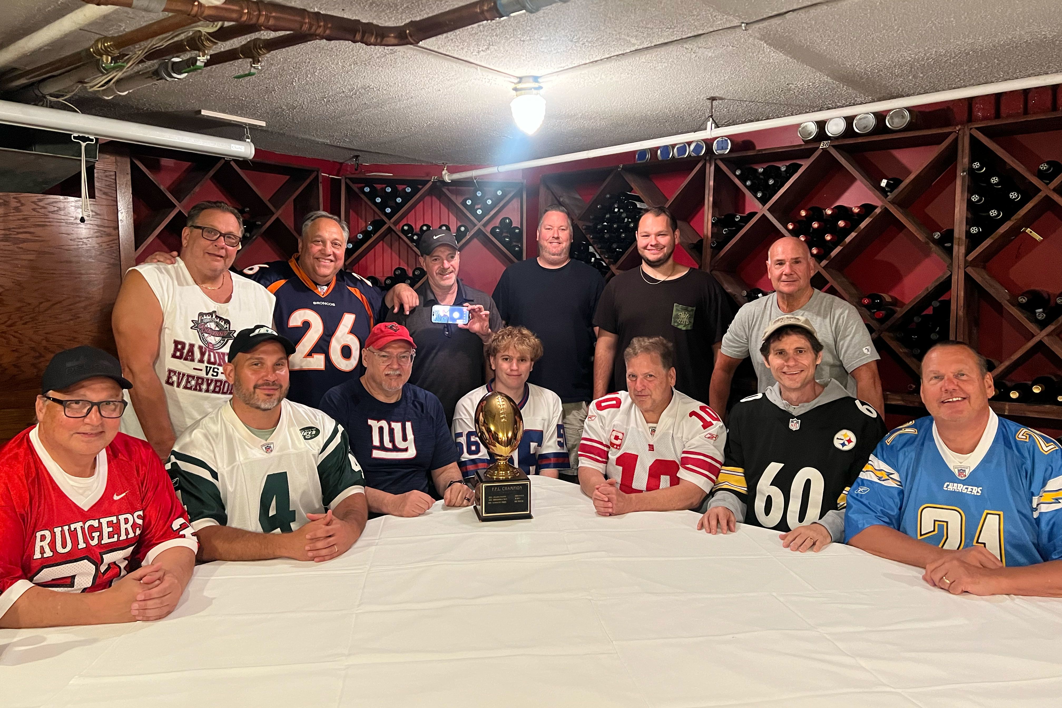 Members of the Sigma Pi fantasy football league pose together for a photo at the Stage Left Steakhouse in New Brunswick, New Jersey, on Sunday, August 30. Standing, from left, are Jim Calandra, Mark Pascal, Brian Lynn, JR Belt, Jimmy Calandra and Bob Triscari. Seated, from left, are Chris Pascal, Brian Pascal, Ed Sullivan, Dominic Mosso, Nick Mosso, Scott Page and league commissioner Dave Koval.