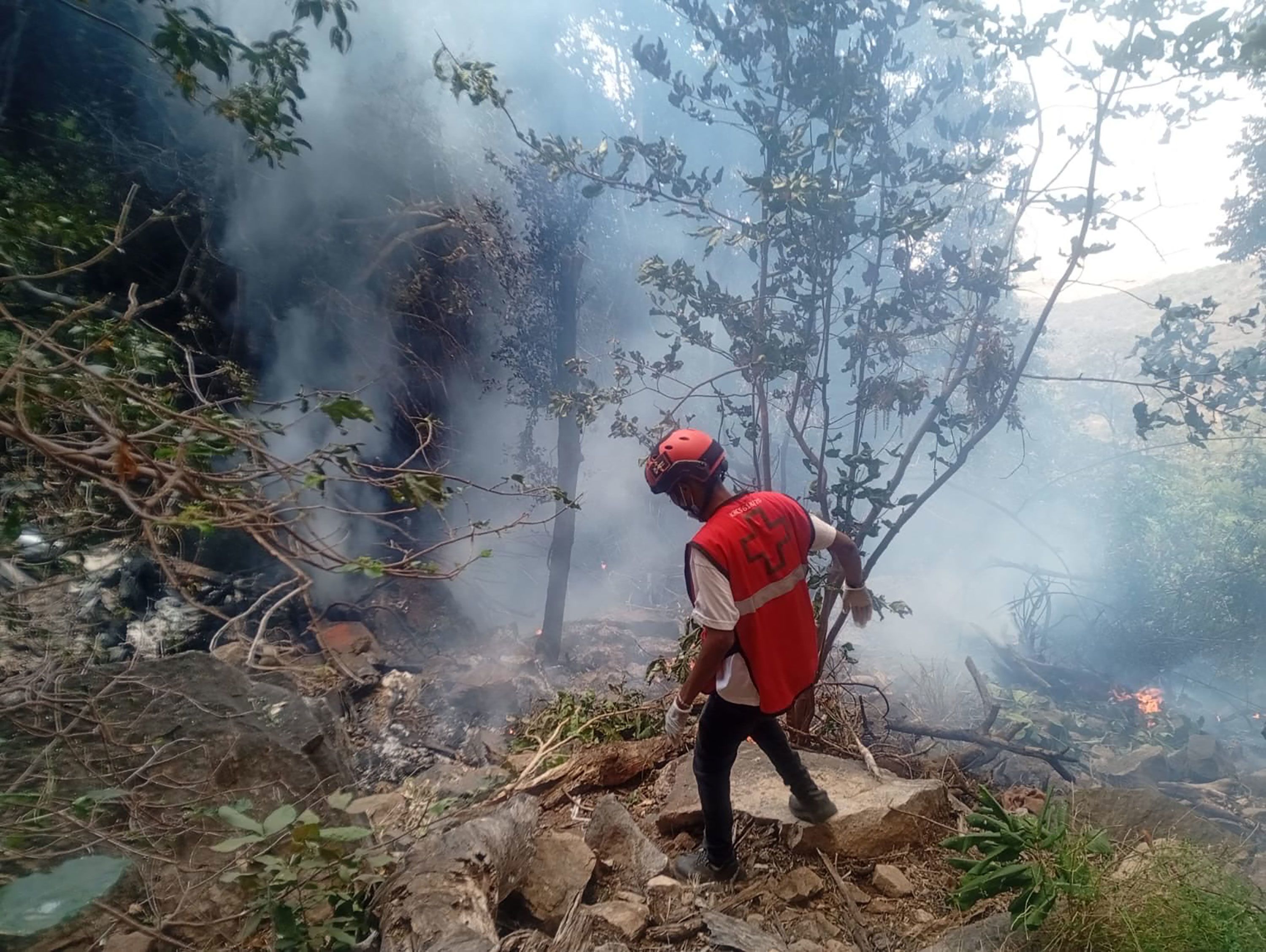 Kenya Red Cross authorities respond to a helicopter crash near Kirish in Samburu County on Wednesday, August 19.