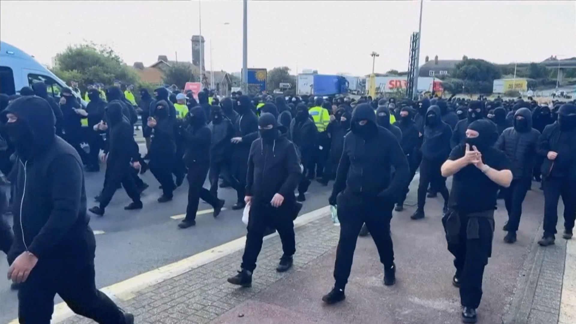 A group of masked men blocked roads on Saturday.