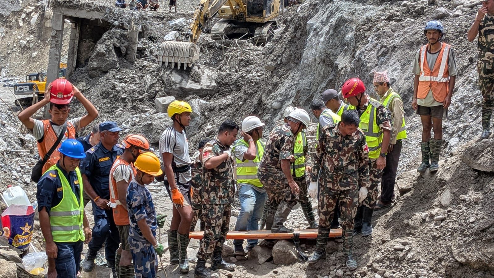 Rescuers continue efforts to free trapped hydro workers after two people were rescued from the Trishuli 3A hydropower tunnel on Friday.