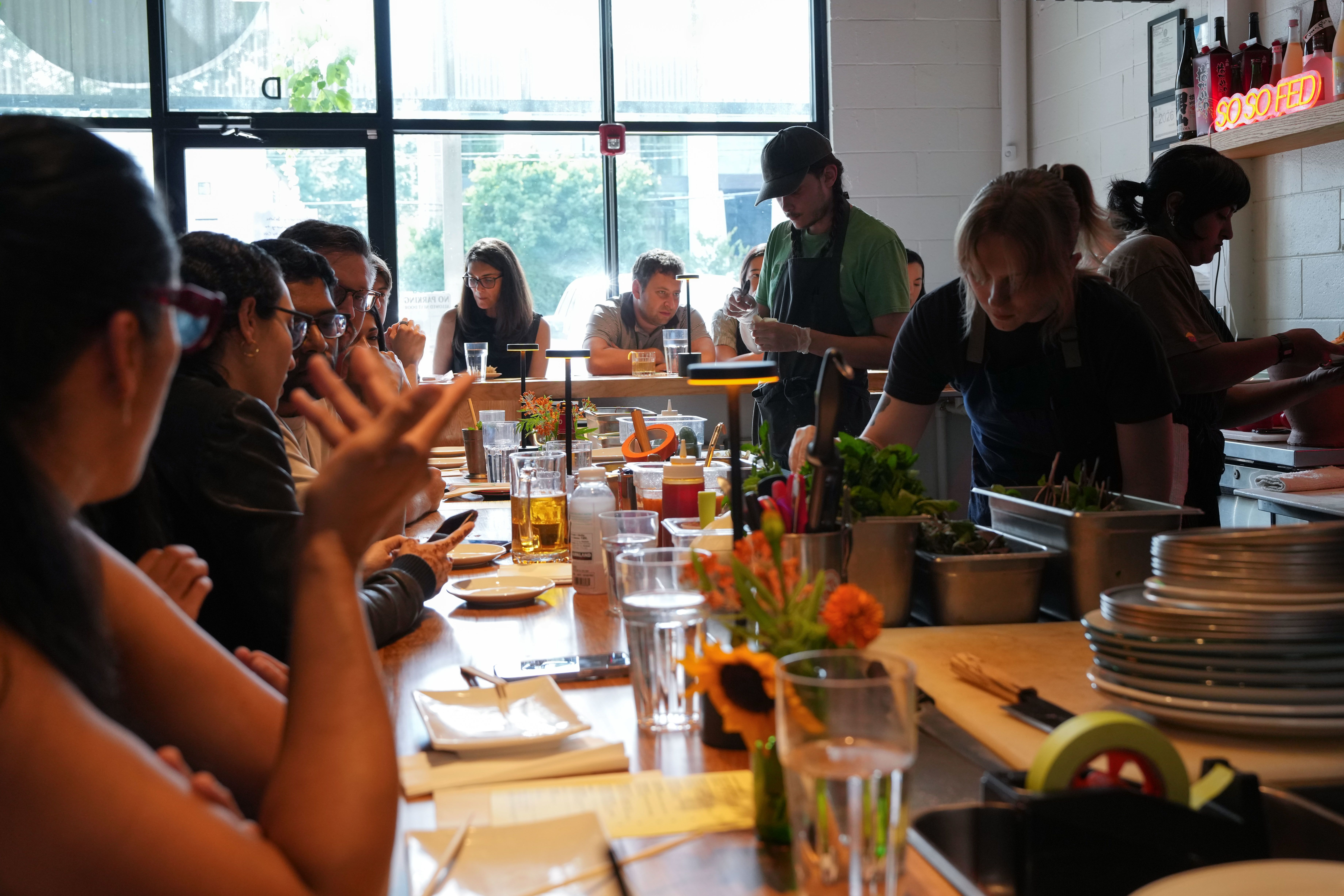 Diners enjoy their meals at the So So Fed pop-up at the OK YAKI restaurant in Atlanta, Georgia, on June 21, 2026.