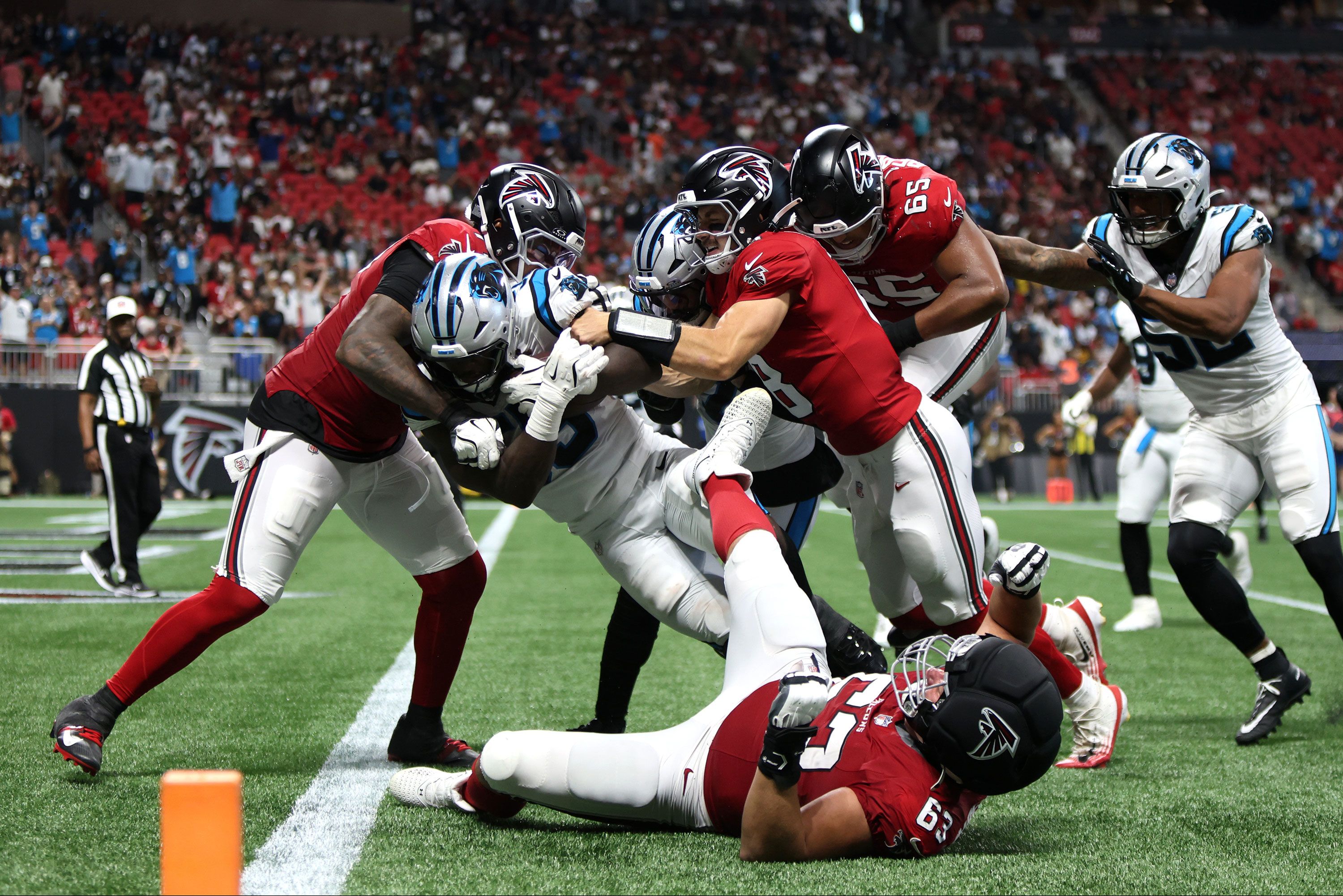 Sep 20, 2026; Atlanta, Georgia, USA;  Carolina Panthers linebacker Devin Lloyd (55) returns an interception for a touchdown during the third quarter against the Atlanta Falcons at Mercedes-Benz Stadium.  Mandatory Credit: Brett Davis-Imagn Images