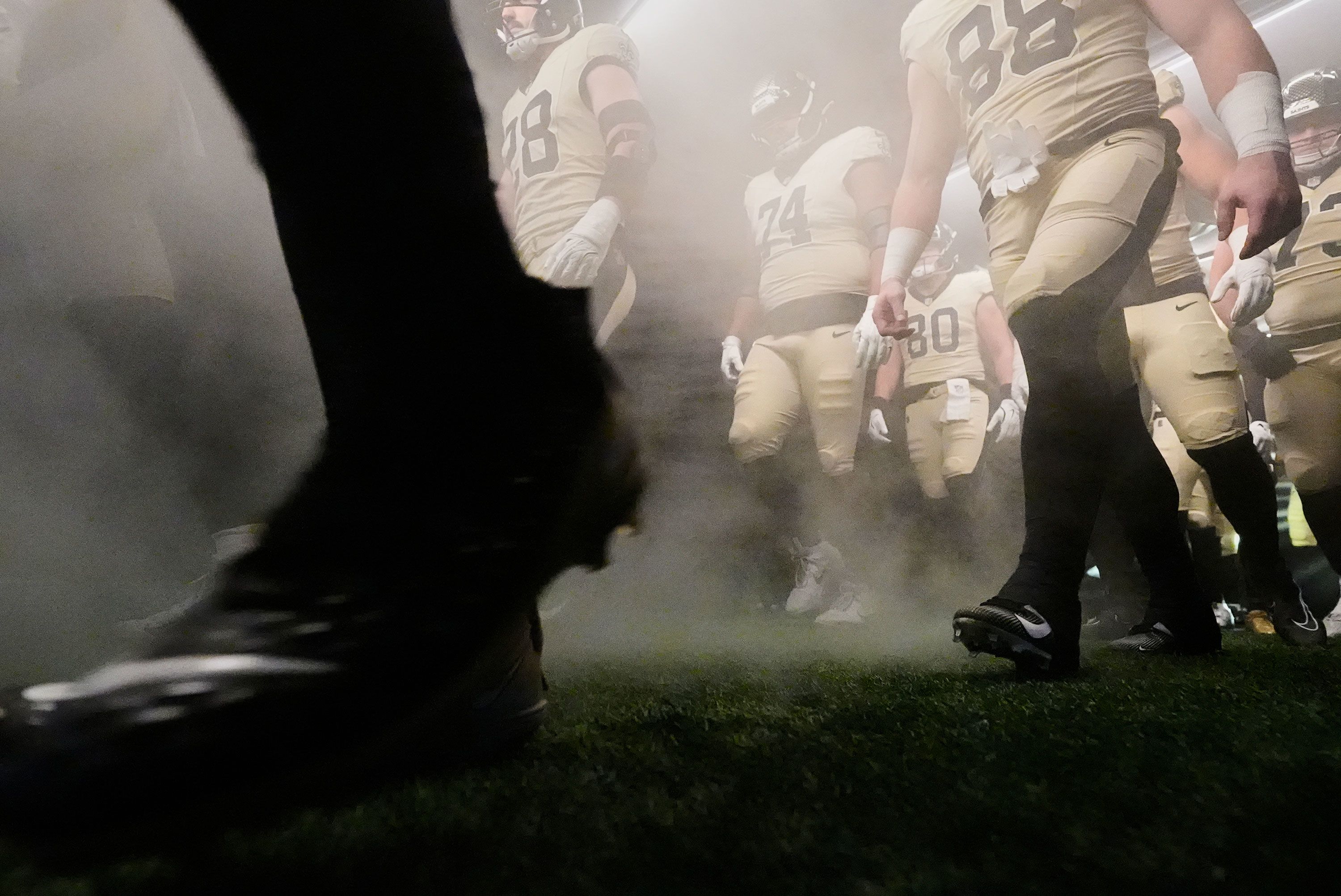 New Orleans Saints players wait in the tunnel to be introduced before an NFL football game against the New York Jets, Sunday, Dec. 21, 2025, in New Orleans. (AP Photo/Gerald Herbert)