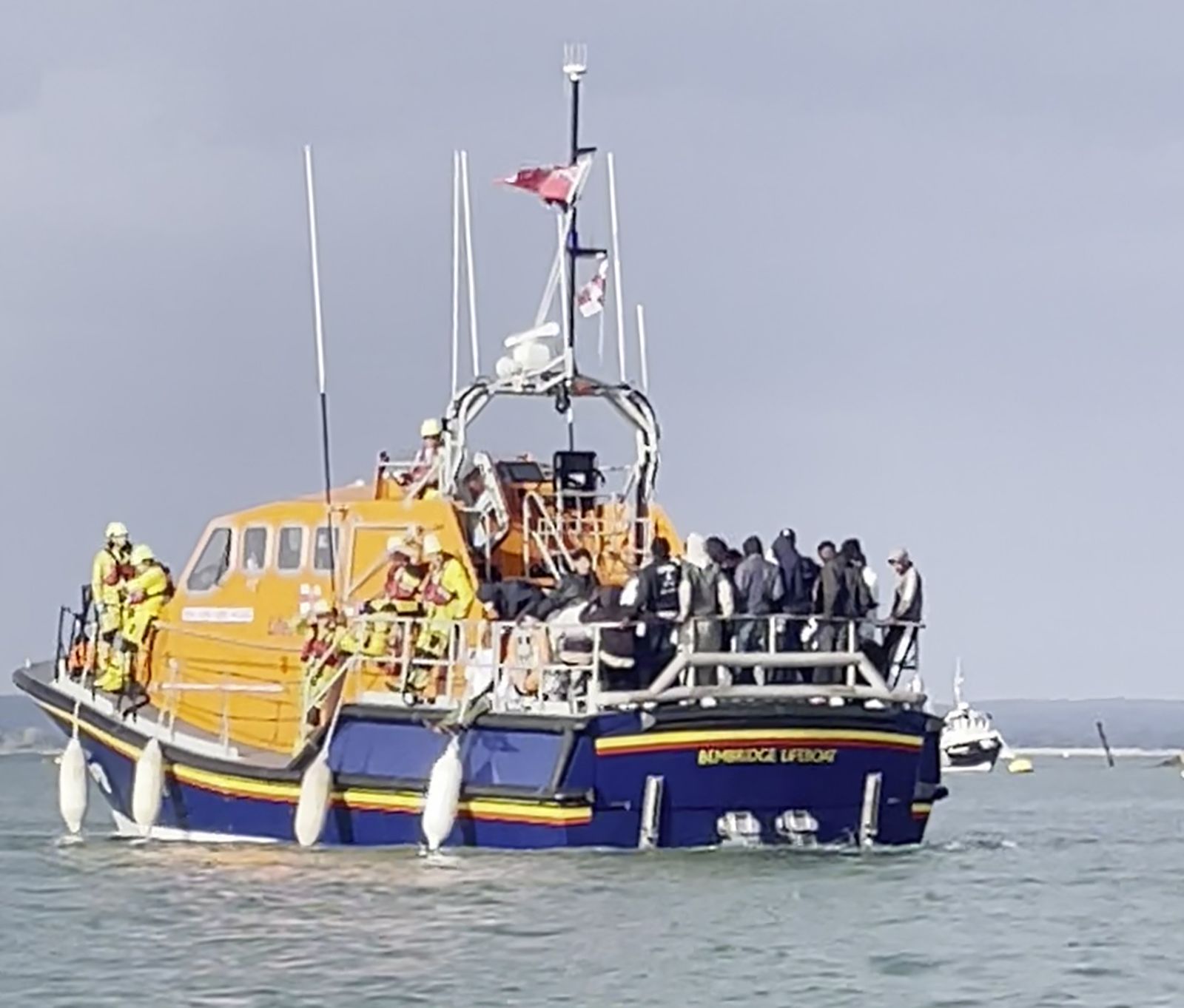 Photo issued on Monday showing people thought to be migrants on board an RNLI lifeboat during a rescue operation near Portsmouth in Hampshire, England.